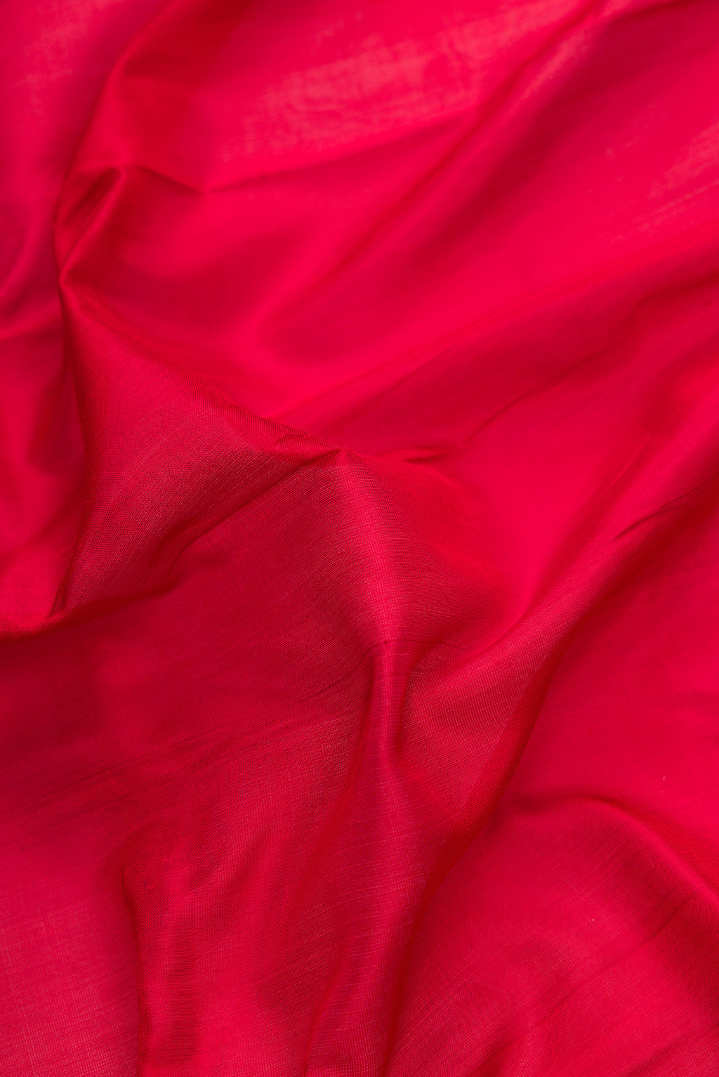 Close up of Maroon Dual Tone Uppada Silk Saree with Plain Body and Zari Border.  displaying folds