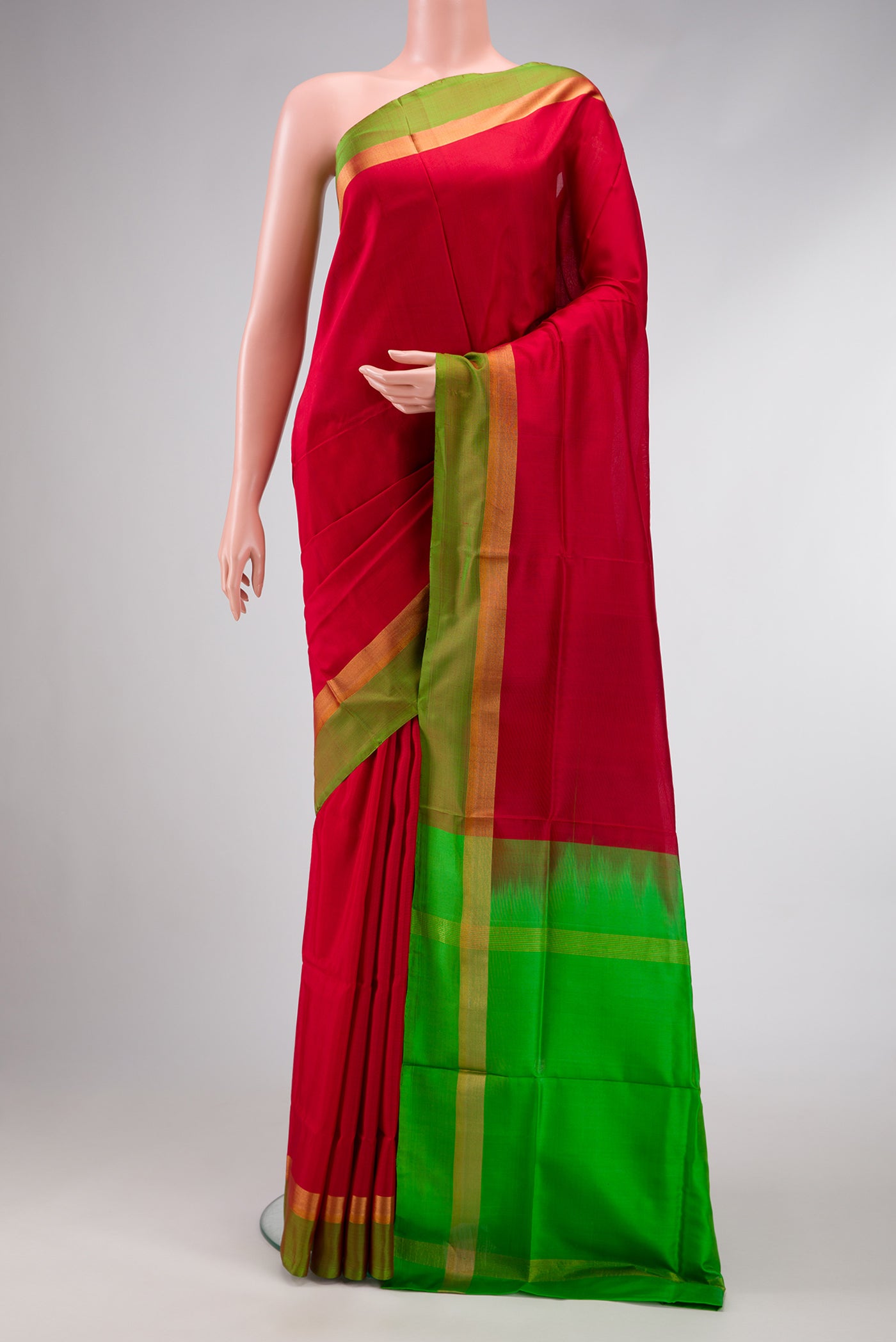 Maroon Dual Tone Uppada Silk Saree with Plain Body and Zari Border.  displayed on a mannequin