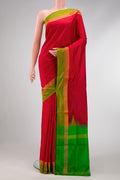 Red Dual Tone Uppada Silk Saree with Plain Body and Zari Border.  displayed on a mannequin