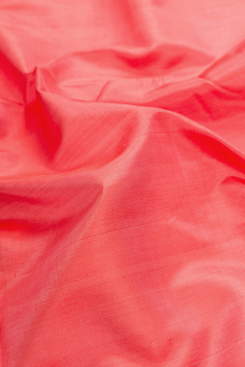 Close up of Peach Dual Tone Uppada Silk Saree with Plain Body and Zari Border.  displaying folds