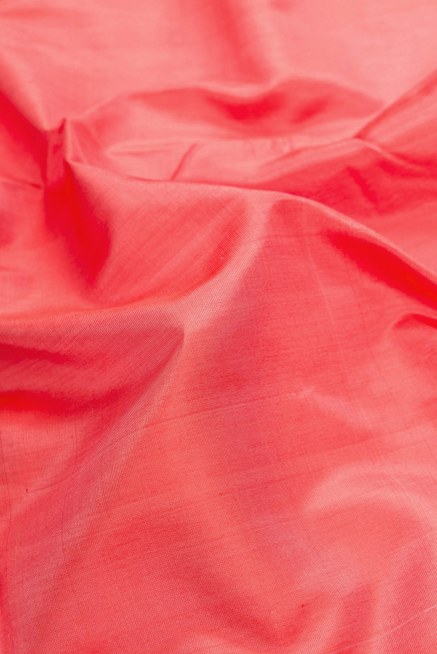 Close up of Peach Dual Tone Uppada Silk Saree with Plain Body and Zari Border.  displaying folds