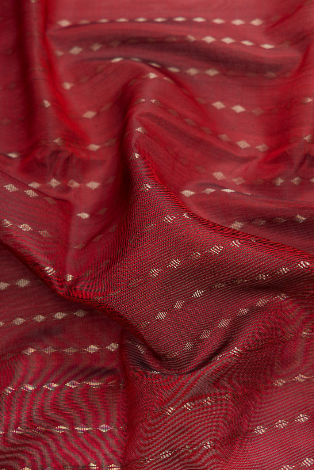 Close up of Maroon Dual Tone Uppada Silk Saree with Stripes on the body and Zari Border.  displaying folds