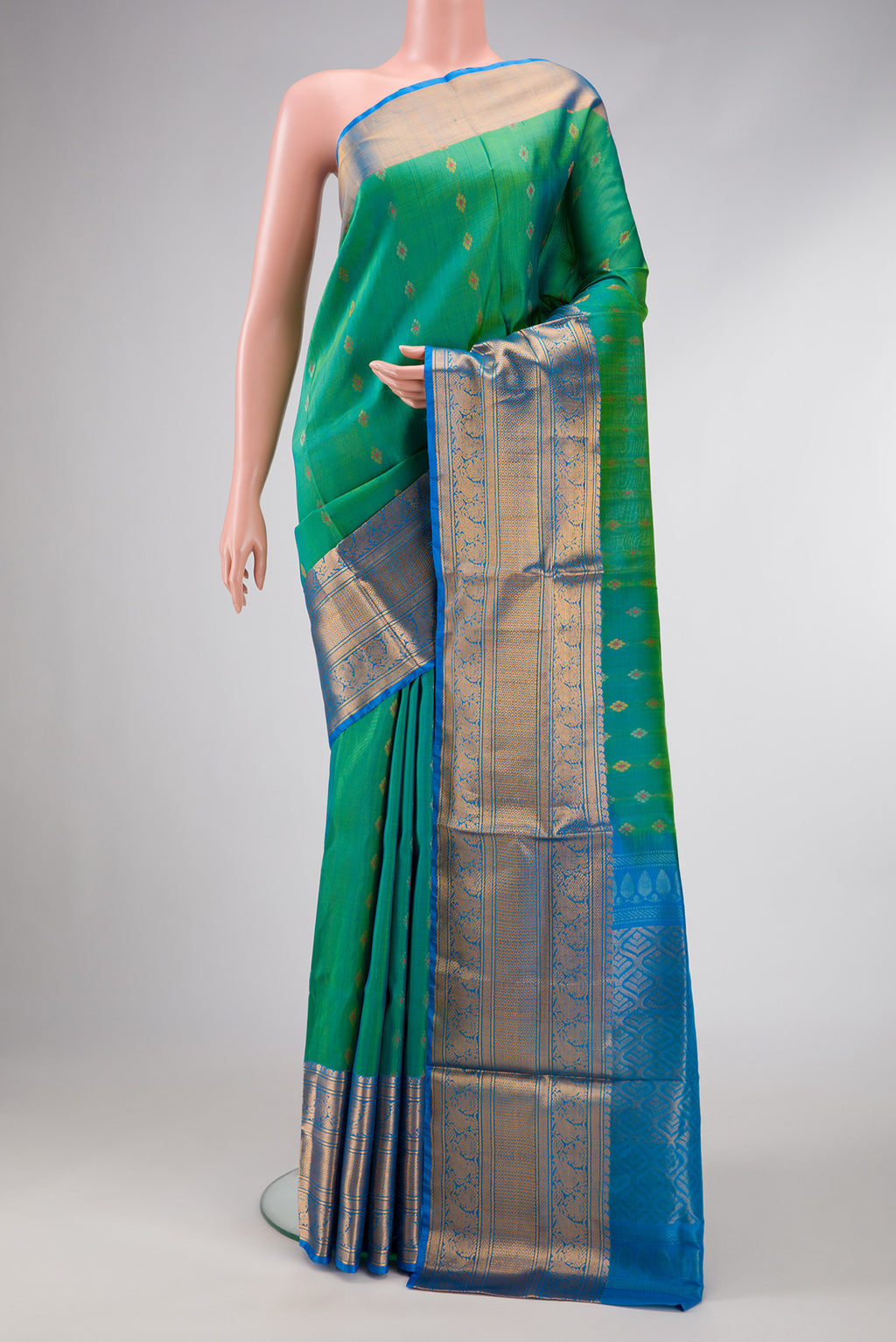 Sea Green Dual Tone Uppada Silk Saree with Zari Butta on the body and Zari Border.  displayed on a mannequin