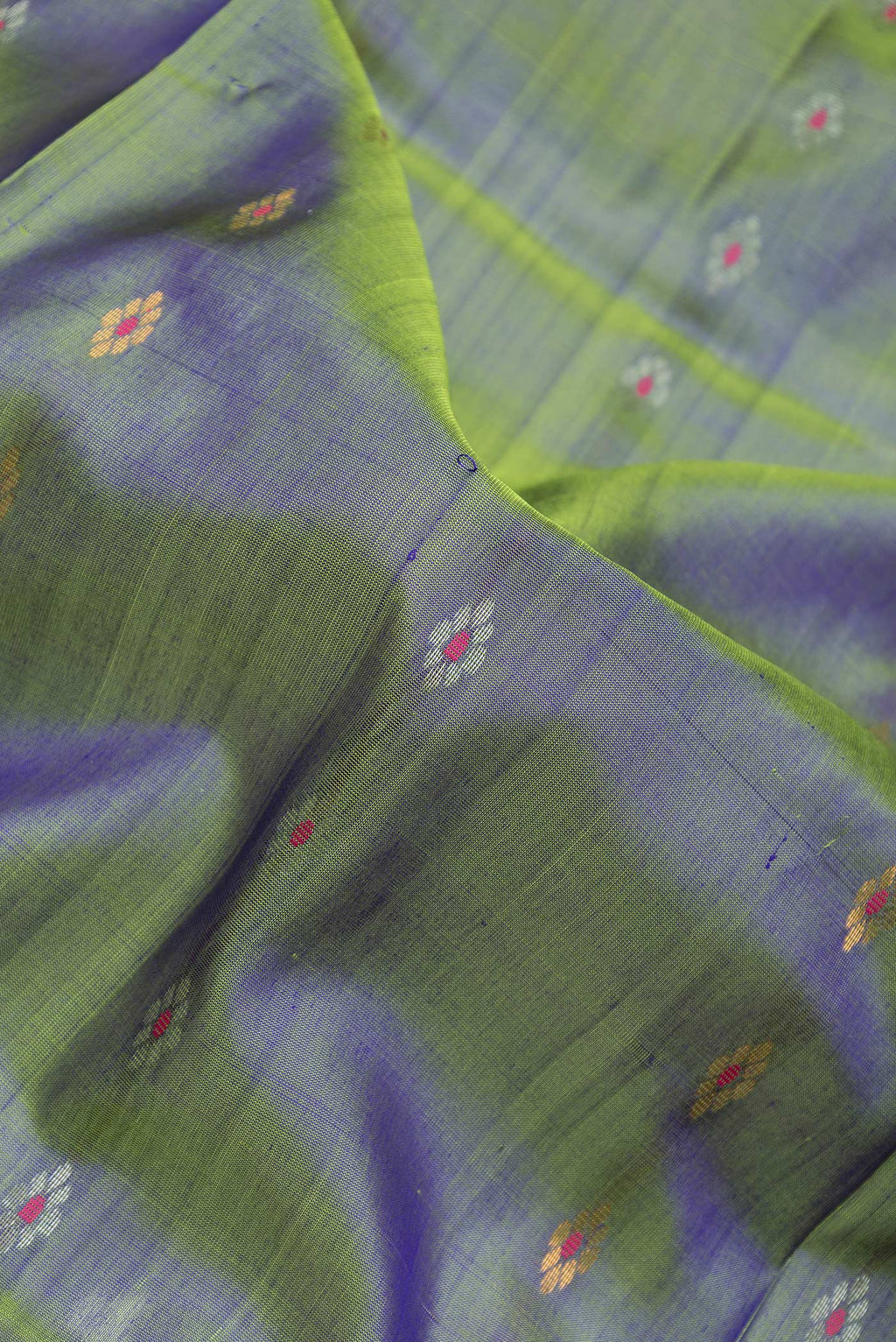 Close up of Green Dual Tone Uppada Silk Saree with Zari And Thread Butta on the body and Zari Border.  displaying folds