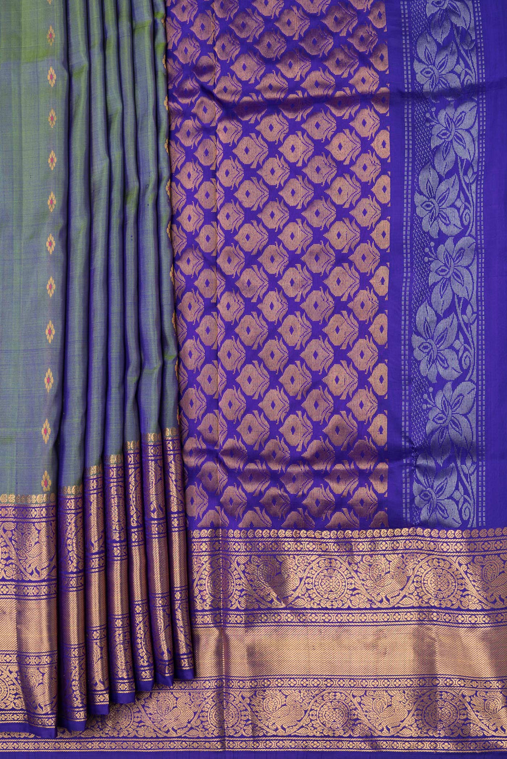 Pleats and pallu of Green Dual Tone Uppada Silk Saree with Zari And Thread Butta on the body and Zari Border. 