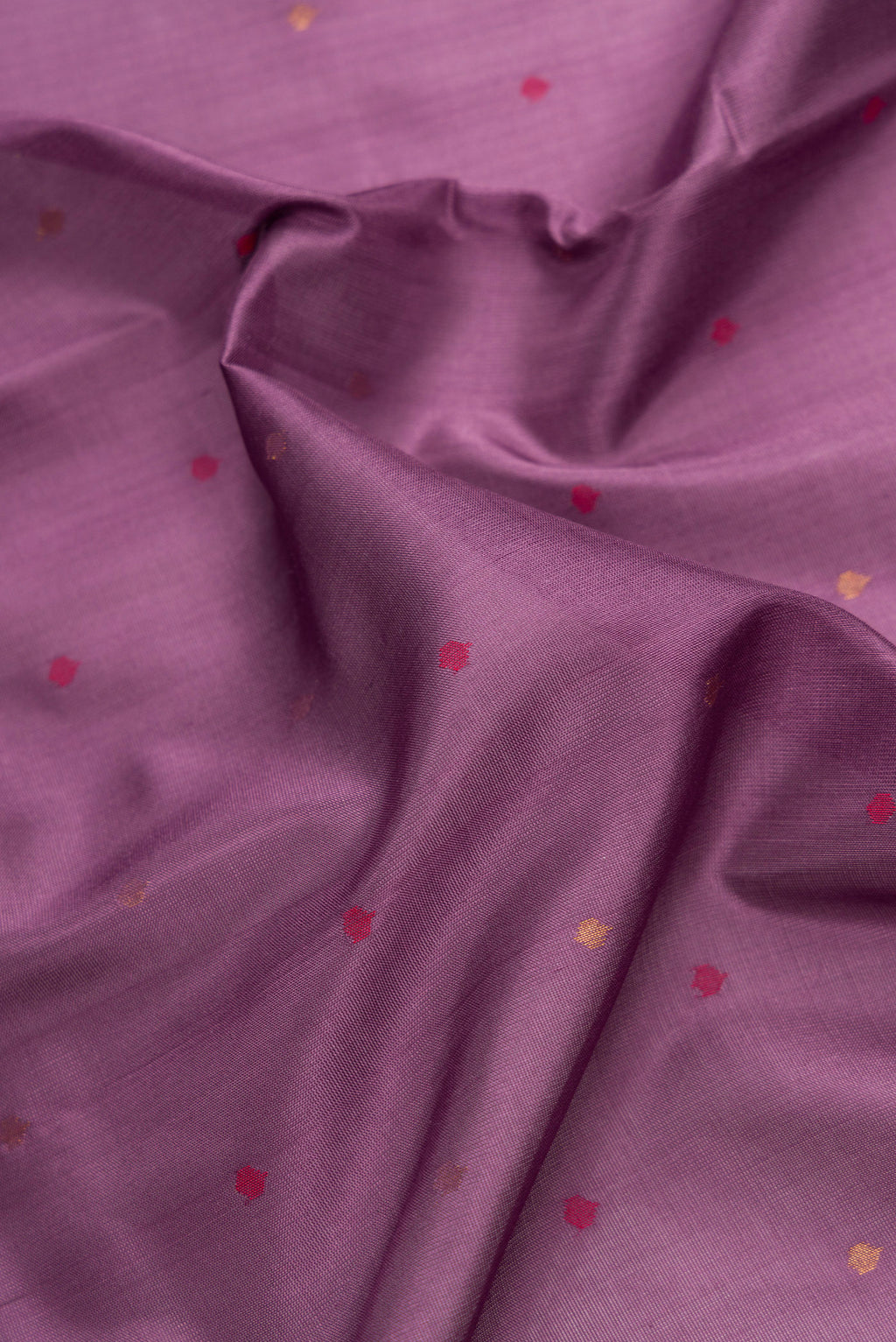 Close up of Lavender Dual Tone Uppada Silk Saree with Zari And Thread Butta on the body and Zari Border.  displaying folds