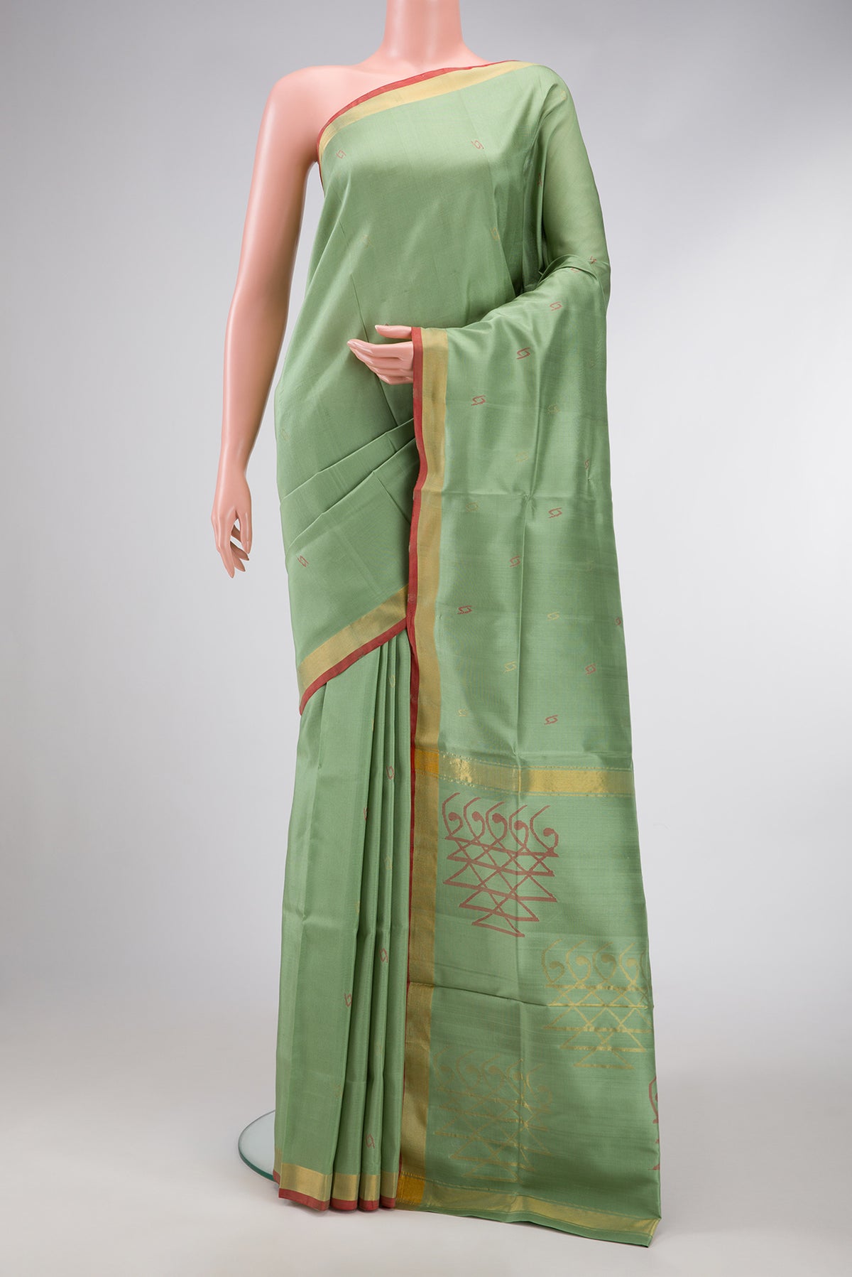 Pista Green Dual Tone Uppada Silk Saree with Zari And Thread Butta on the body and Zari Border.  displayed on a mannequin