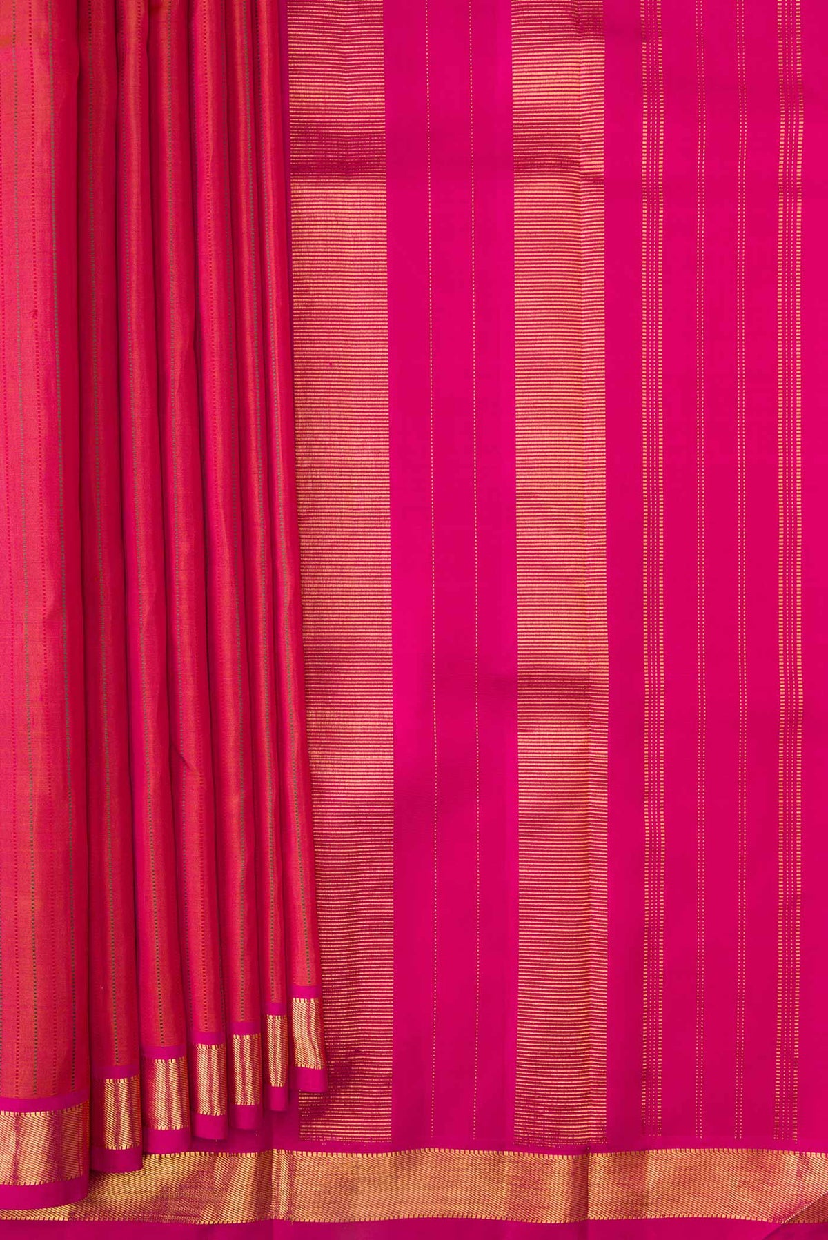 Pleats and pallu of Dark Mauve Dual Tone Kanchipuram Silk Saree with Stripes on the body and Zari Border. 