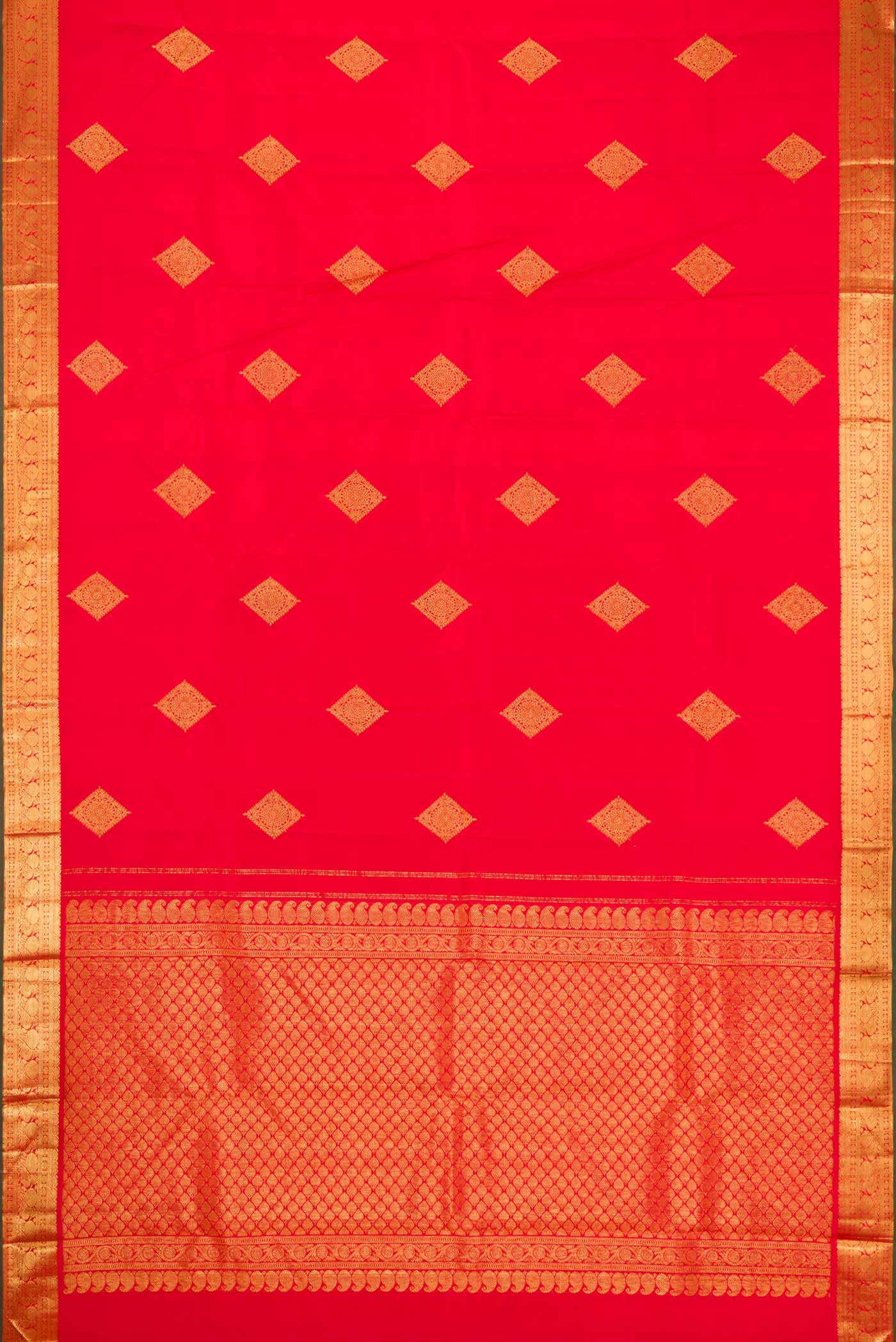 Flat view of Red Dual Tone Kanjivaram Silk Saree with Zari Butta on the body and Zari Border. 