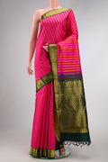 Pink Dual Tone Kanjivaram Silk Saree with Stripes on the body and Zari Border.  displayed on a mannequin