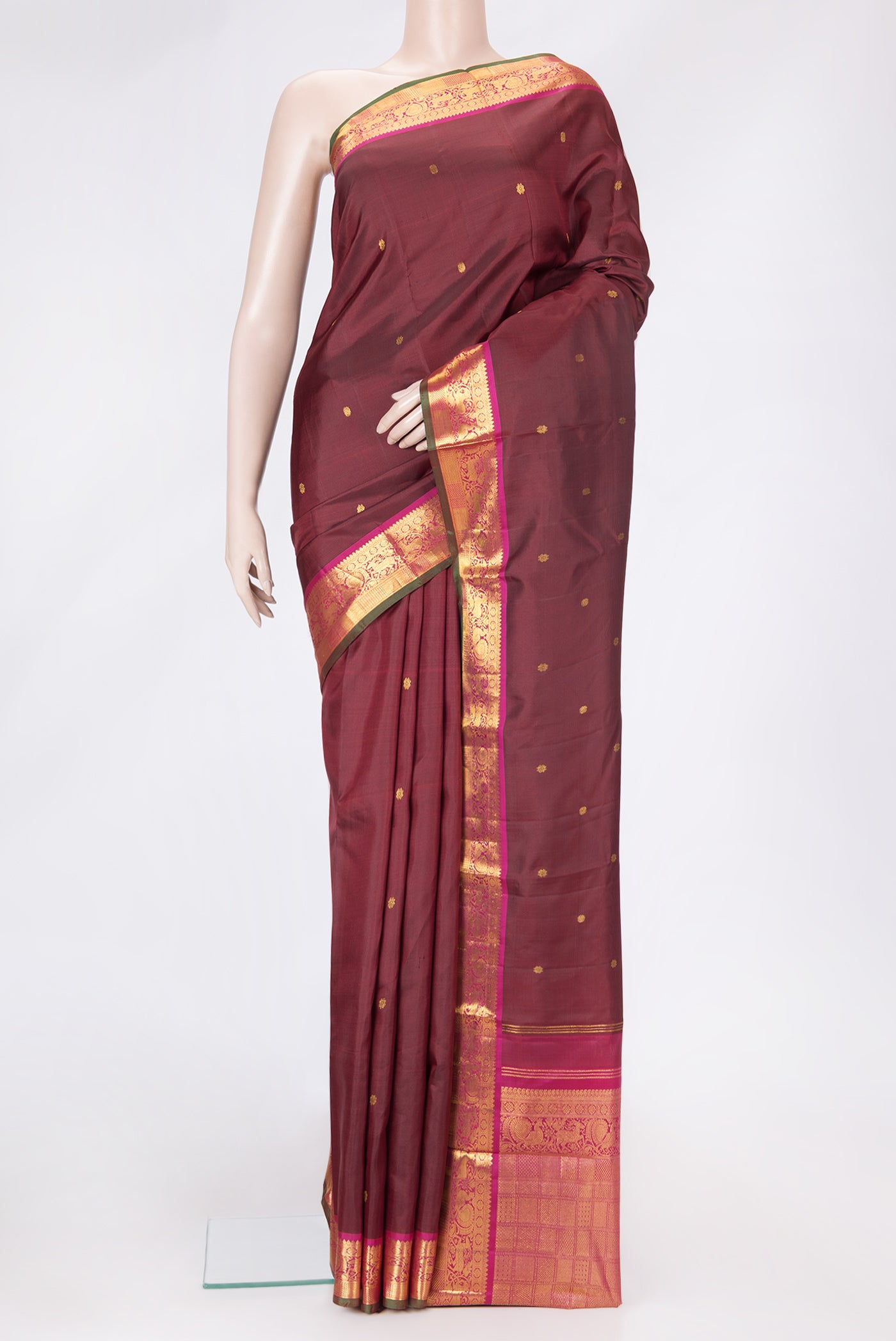 Maroon Dual Tone Kanchipuram Silk Saree with Zari Butta on the body and Zari Border.  displayed on a mannequin