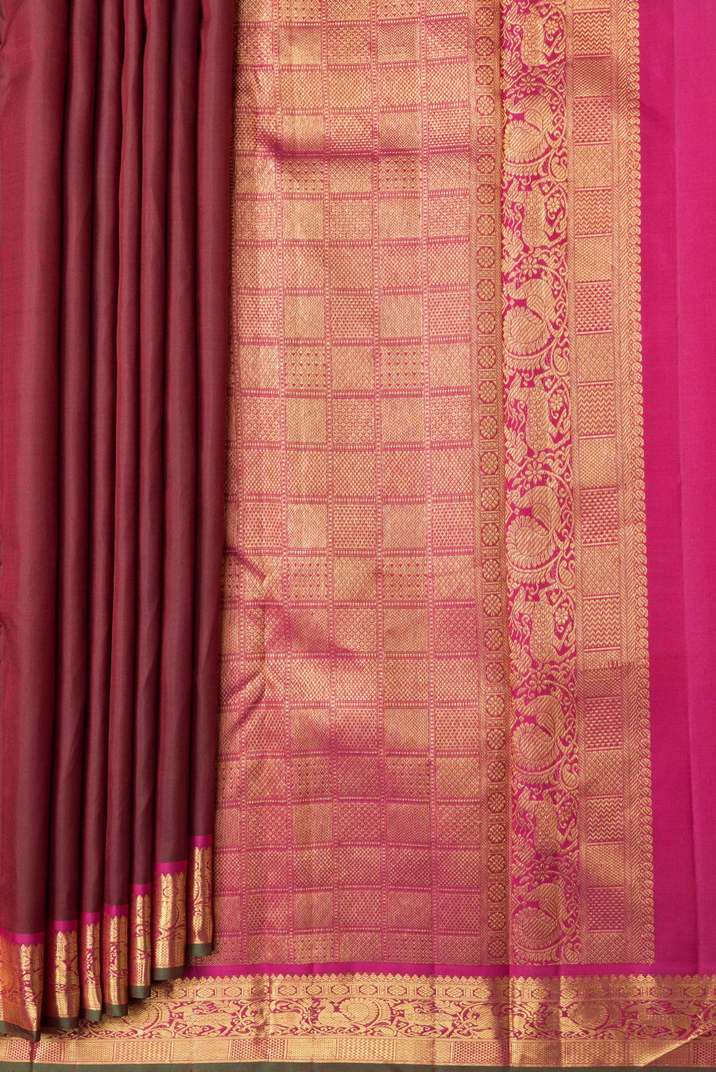 Pleats and pallu of Maroon Dual Tone Kanchipuram Silk Saree with Zari Butta on the body and Zari Border. 