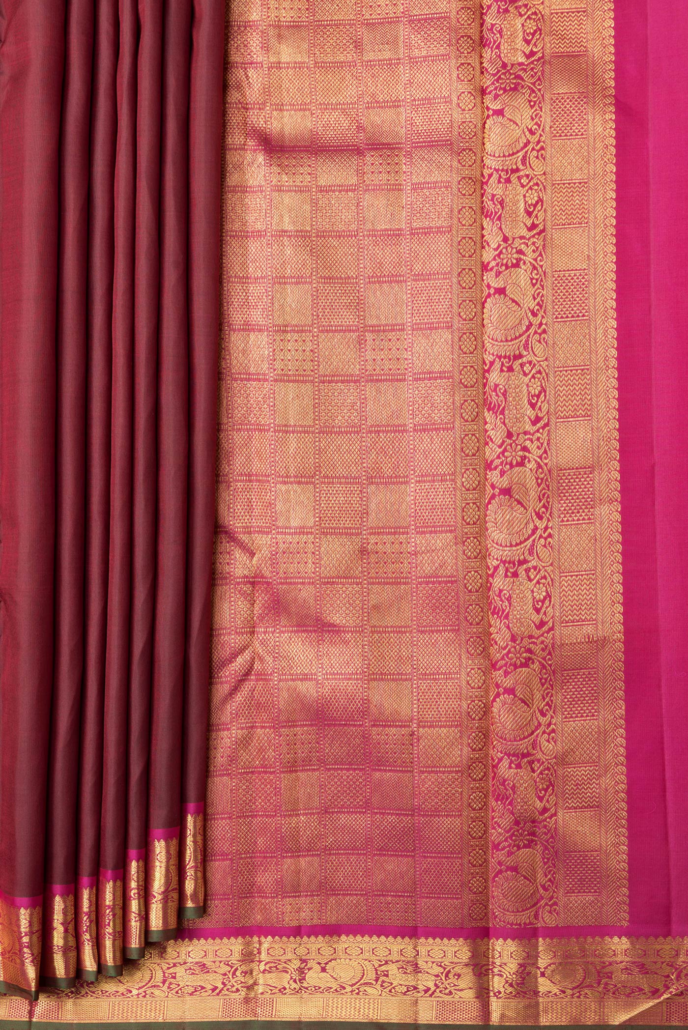 Pleats and pallu of Maroon Dual Tone Kanchipuram Silk Saree with Zari Butta on the body and Zari Border. 