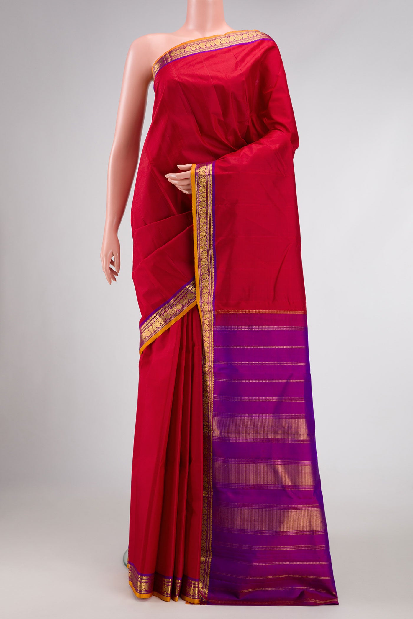 Maroon Dual Tone Kanjivaram Silk Saree with Plain Body and Zari Border.  displayed on a mannequin