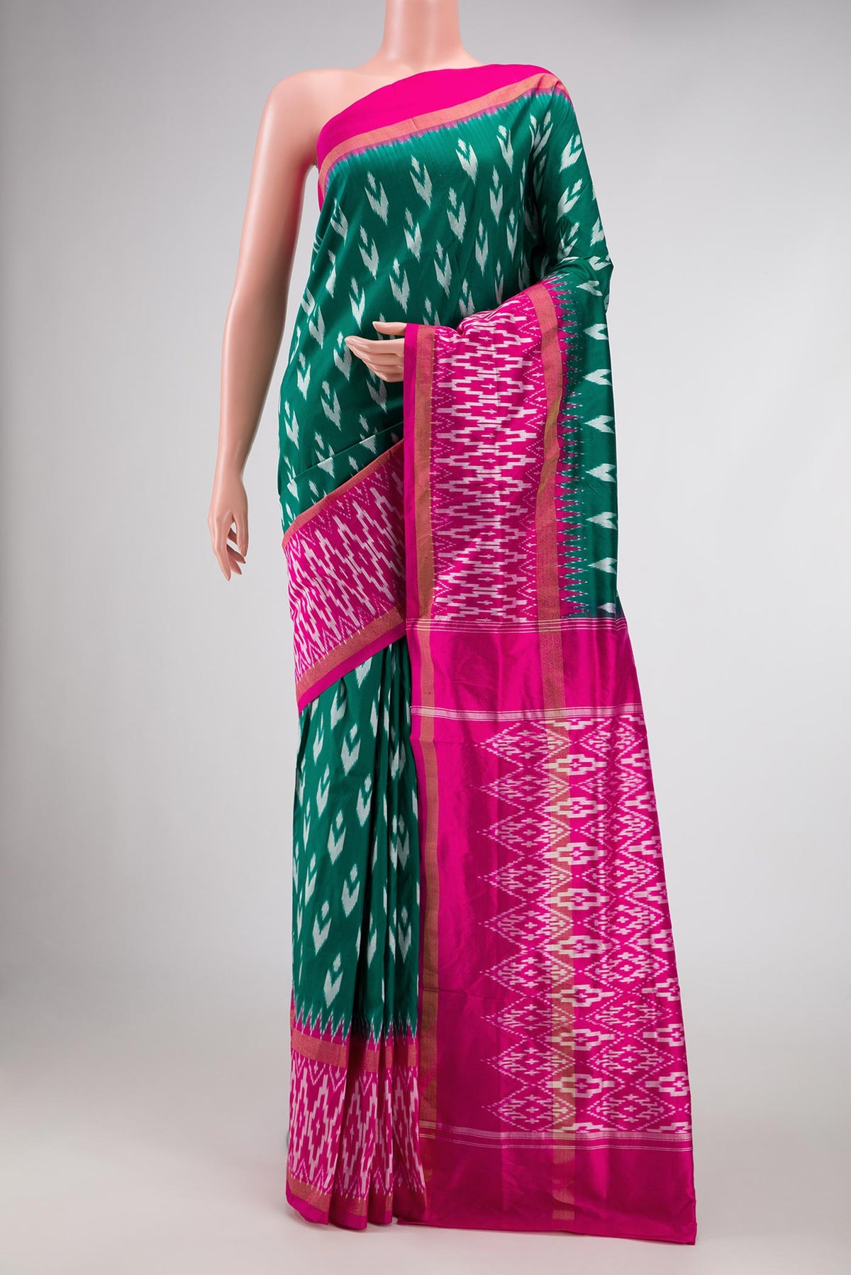 Green Pochampally Silk Saree with Pure Ikat on the body and Ikat Border displayed on a mannequin