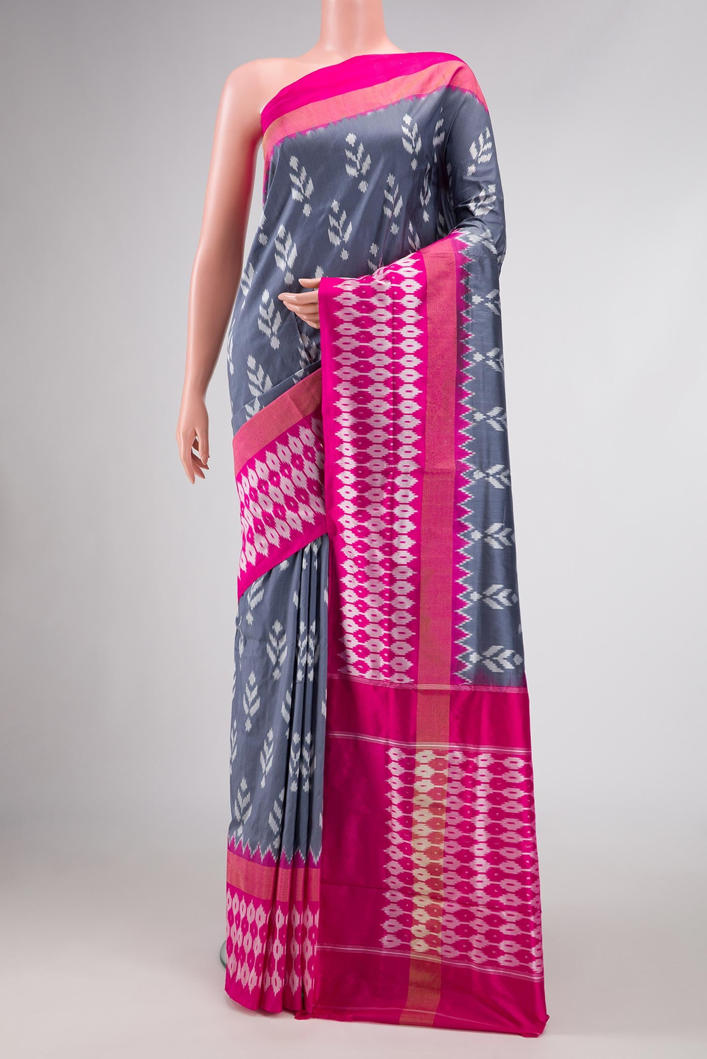 Grey Dual Tone Double Ikat Saree with Ikat Print on the body and Ikat Border.  displayed on a mannequin