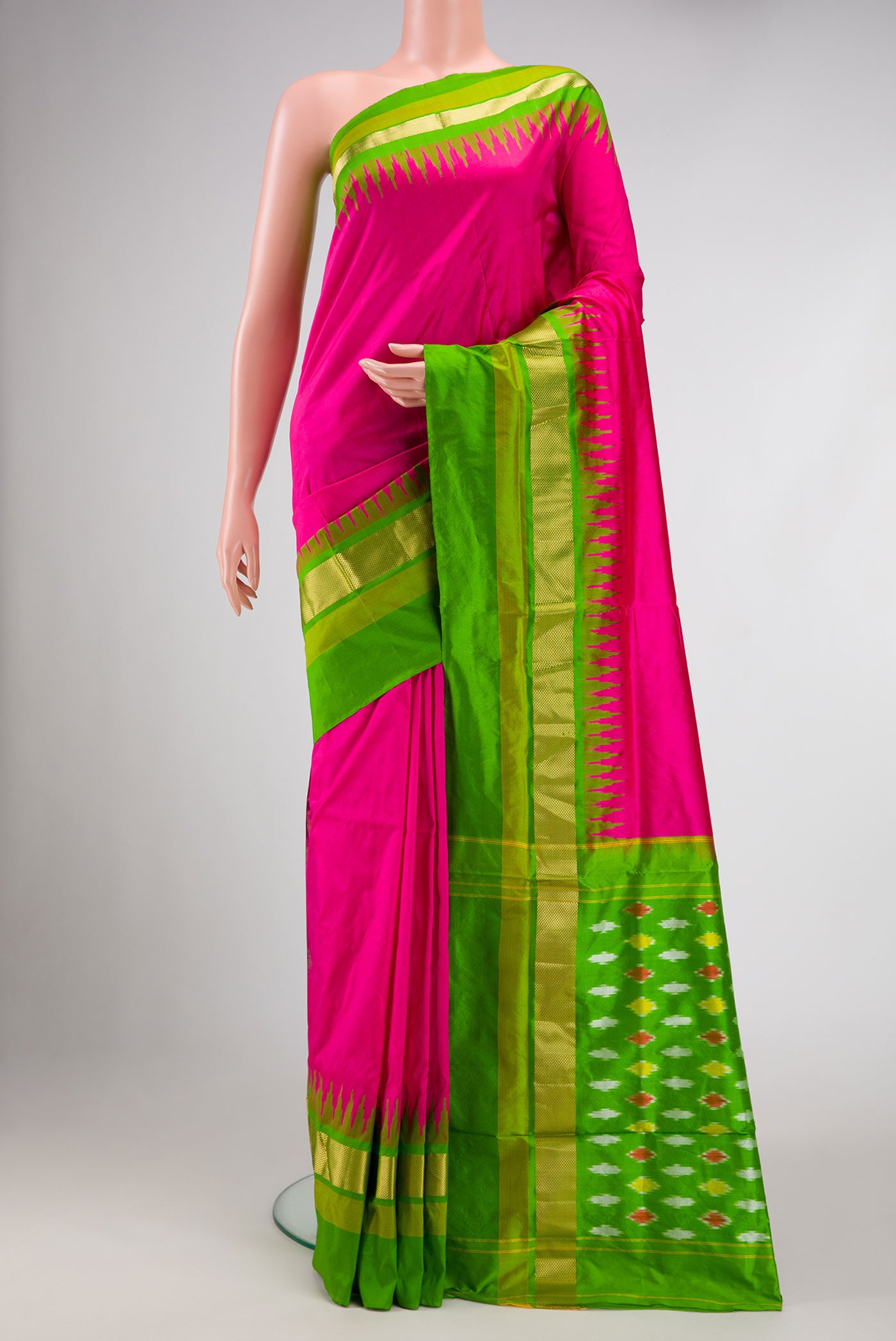 Pink Pochampally Silk Saree with Plain Body and Zari Border displayed on a mannequin