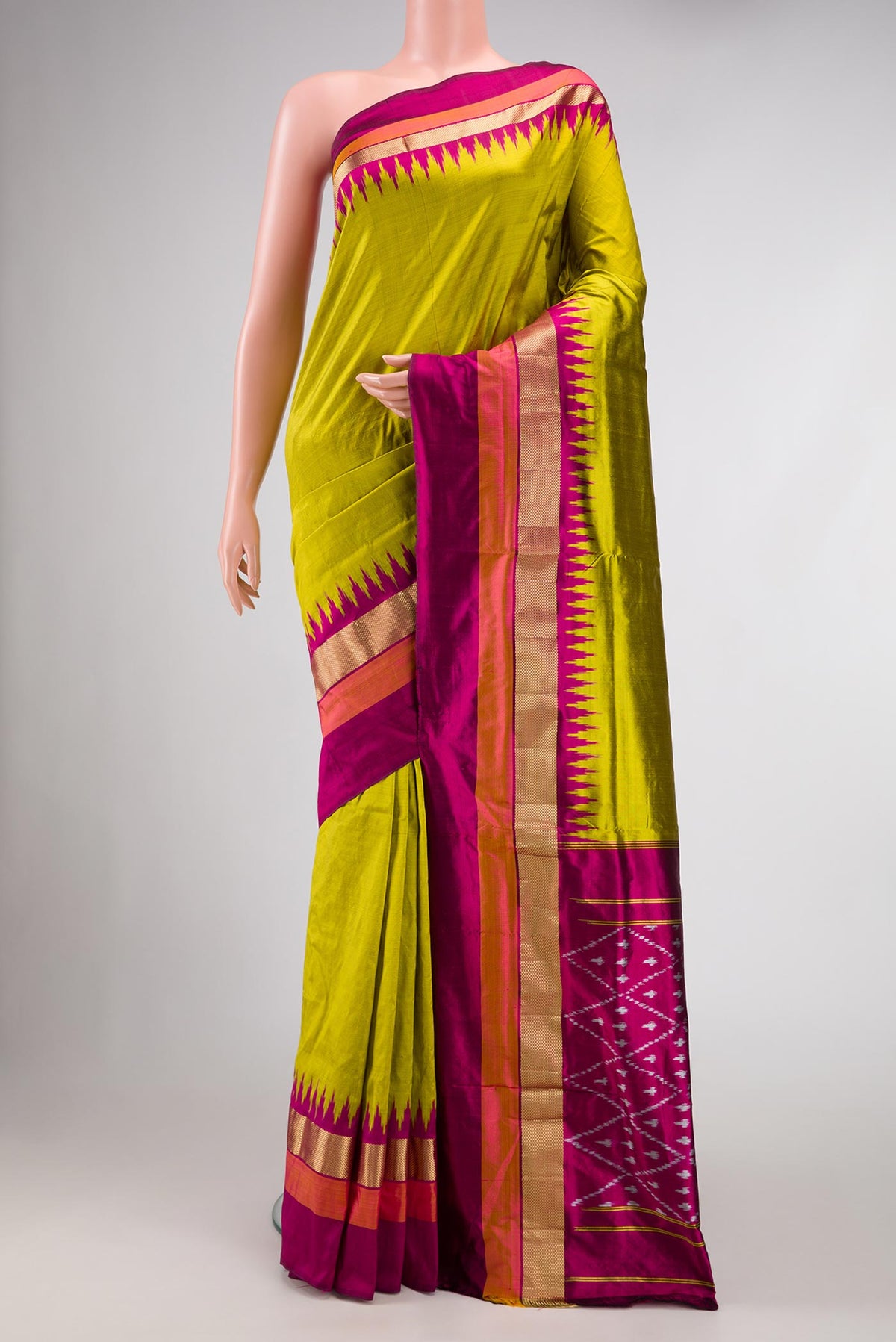 Parrot Green Dual Tone Double Ikat Saree with Plain Body and Zari Border.  displayed on a mannequin