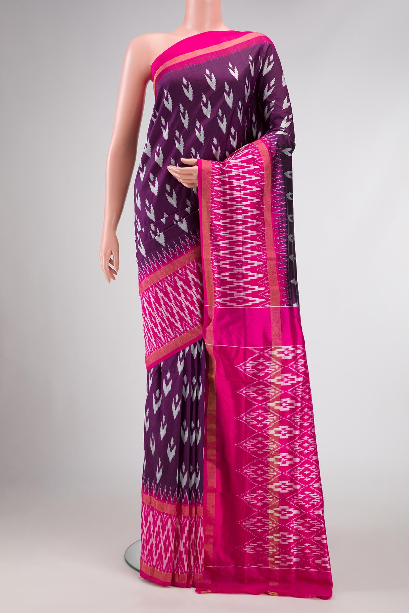Burgundy Dual Tone Double Ikat Saree with Ikat Print on the body and Ikat Border.  displayed on a mannequin