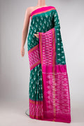 Green Dual Tone Double Ikat Saree with Ikat Print on the body and Ikat Border.  displayed on a mannequin