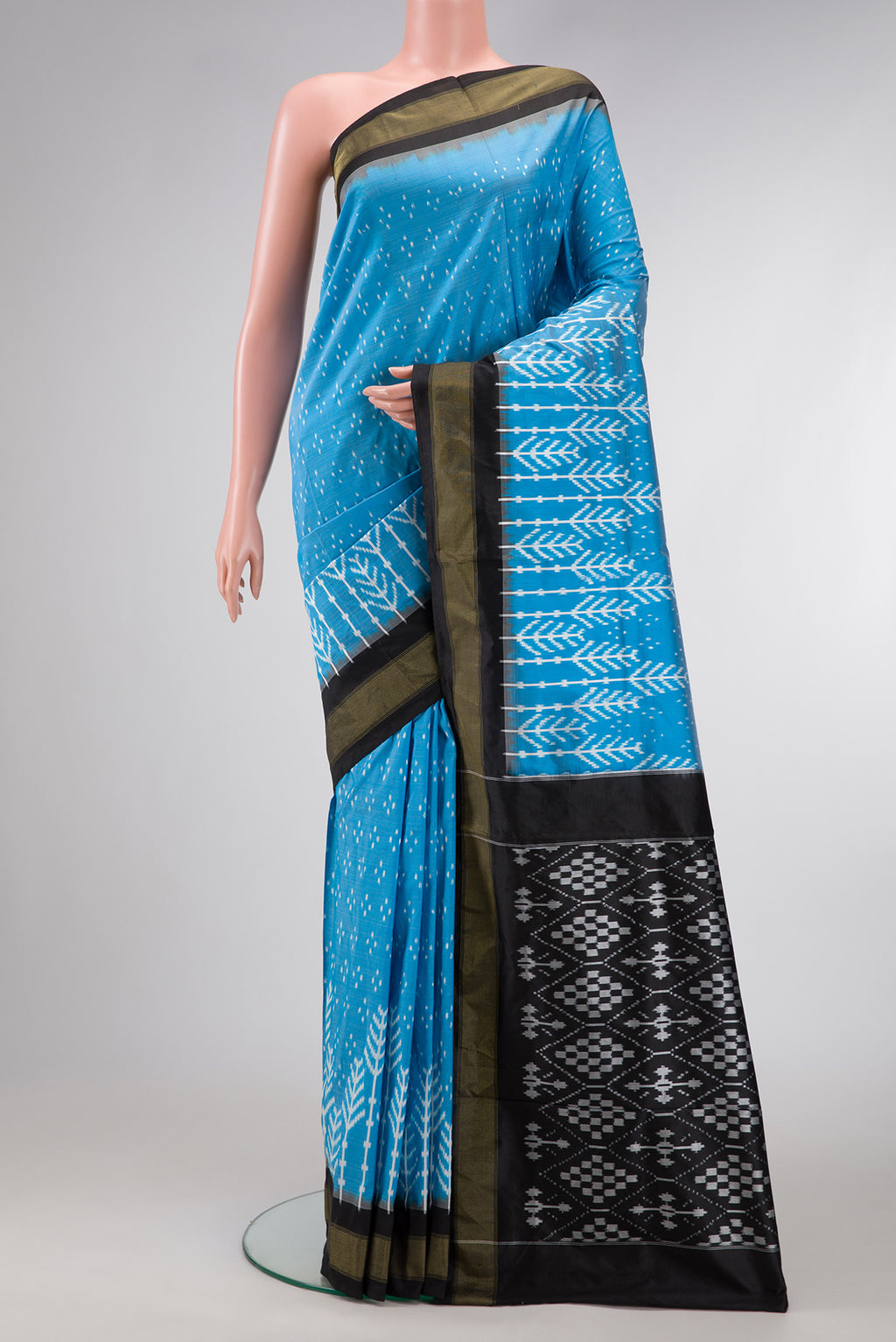 Sky Blue Dual Tone Double Ikat Saree with Ikat Print on the body and Zari Border.  displayed on a mannequin