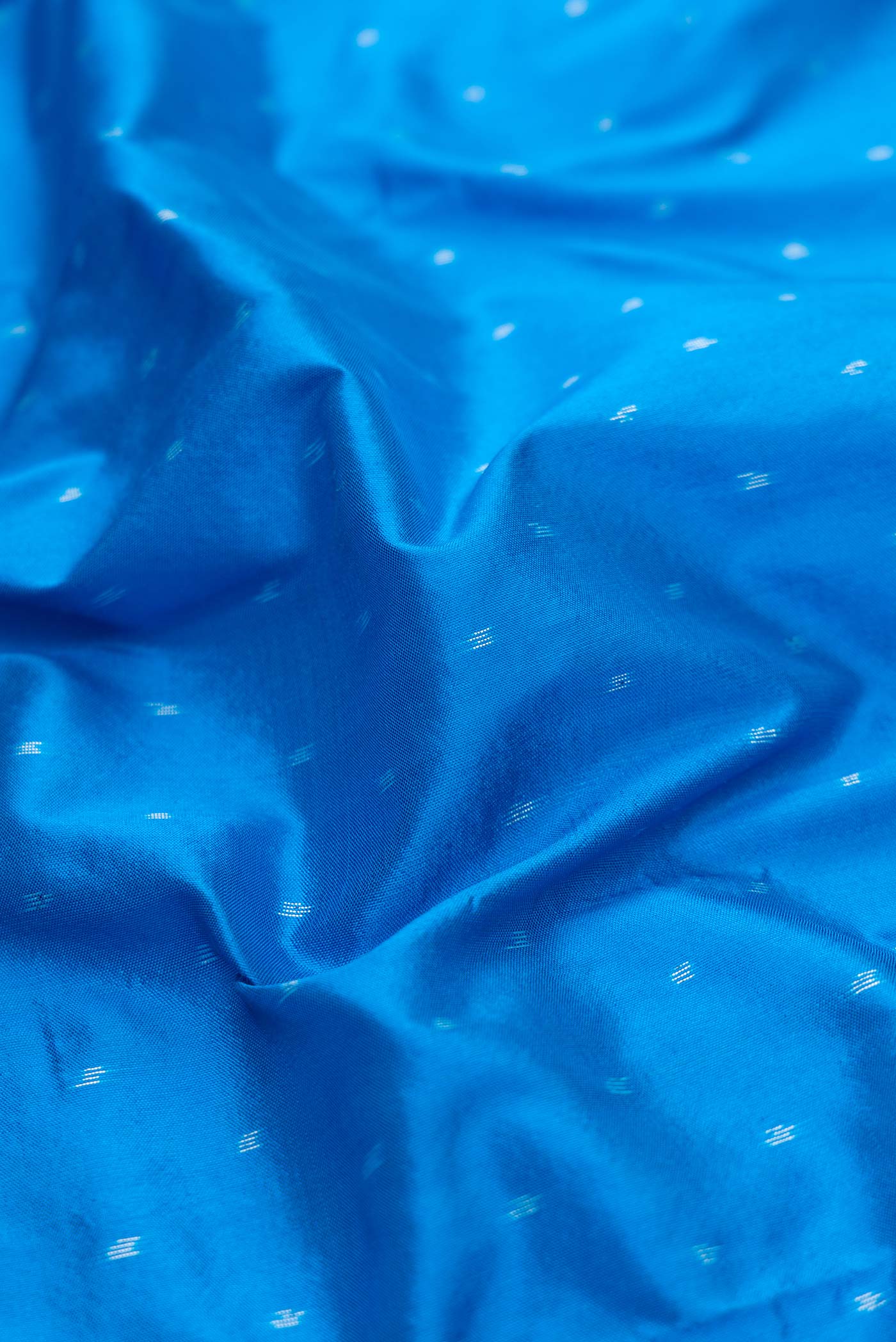 Close up of Royal Blue Pochampally Silk Saree with Pure Ikat on the body and Ikat Border displaying folds