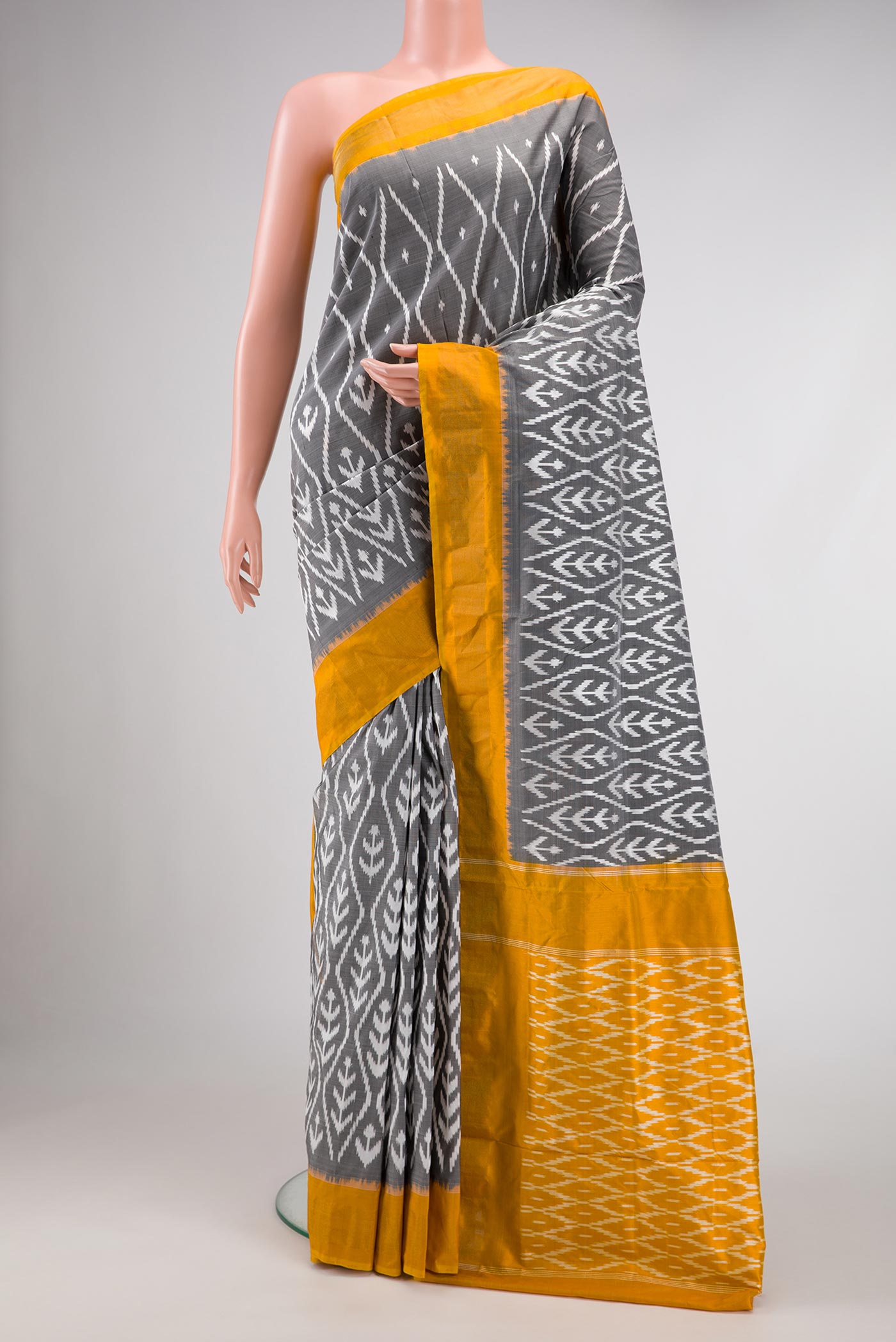 Grey Pochampally Silk Saree with Pure Ikat on the body and Zari Border displayed on a mannequin