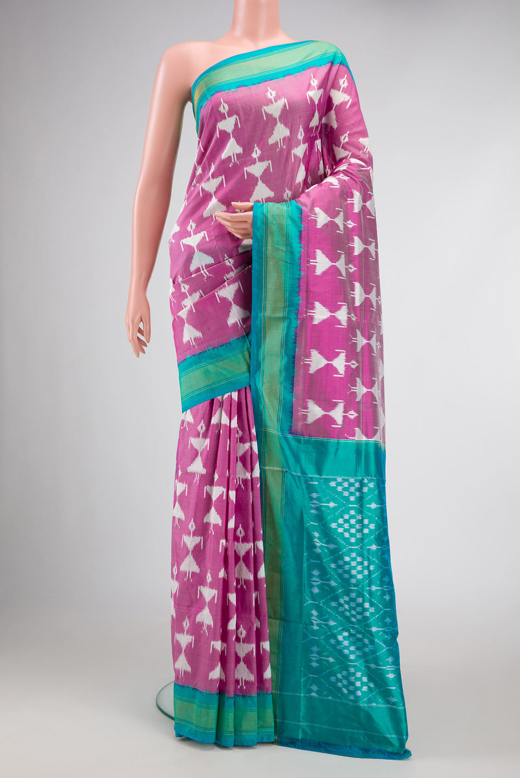 Pink Dual Tone Double Ikat Saree with Ikat Print on the body and Zari Border.  displayed on a mannequin