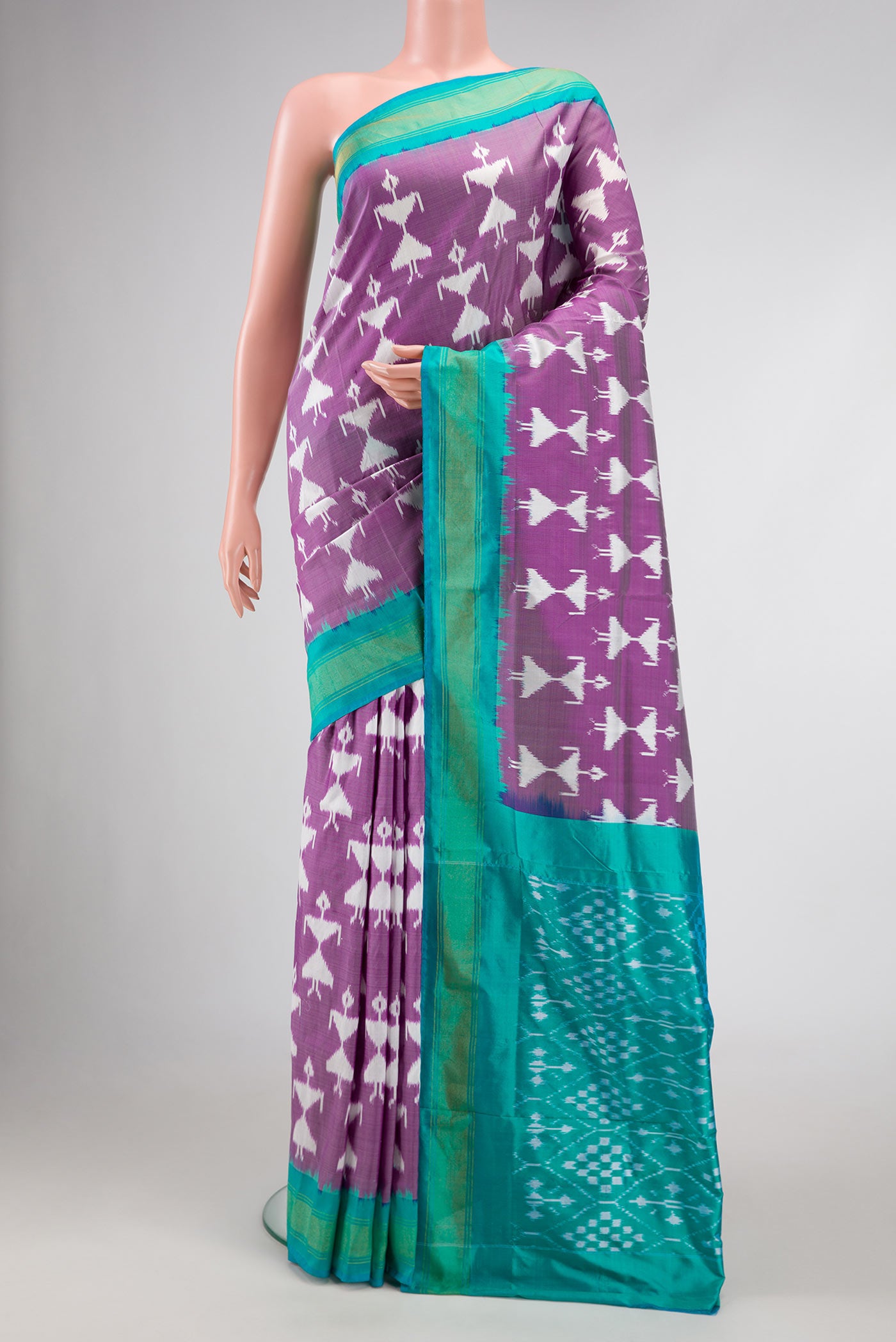 Purple Dual Tone Double Ikat Saree with Ikat Print on the body and Zari Border.  displayed on a mannequin