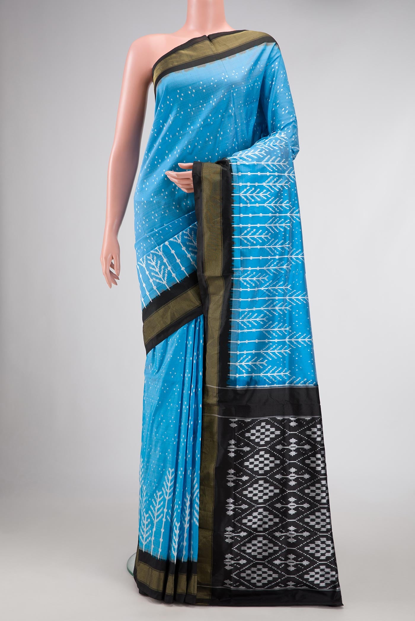 Sky Blue Pochampally Silk Saree with Pure Ikat on the body and Zari Border displayed on a mannequin