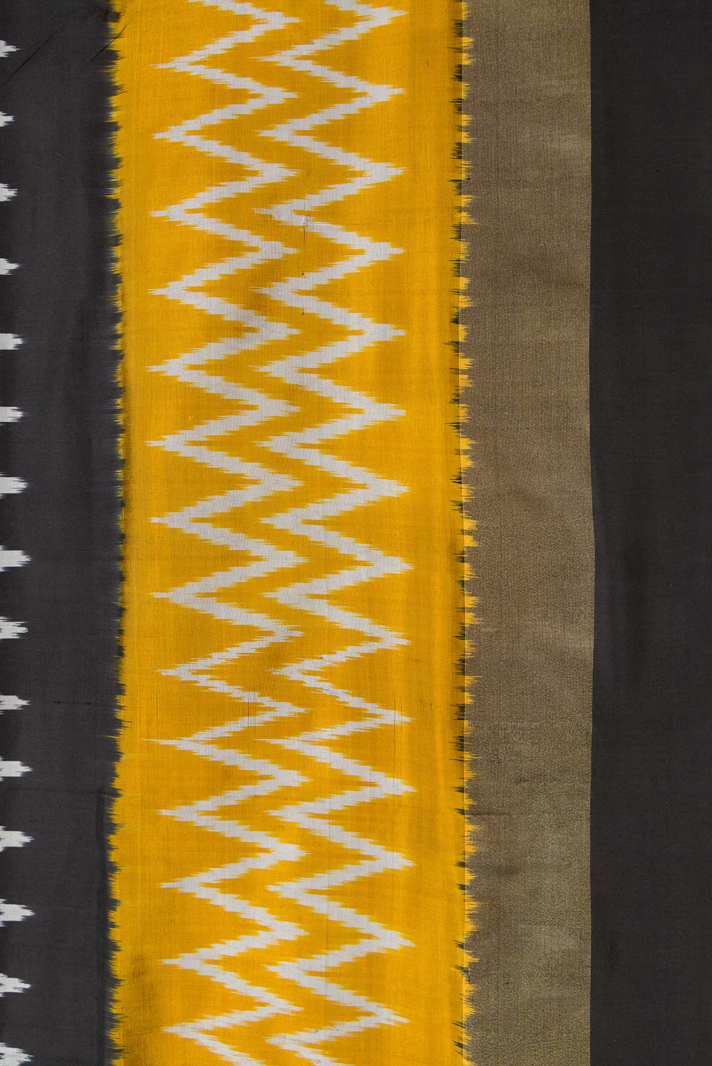 Border image of Black Dual Tone Double Ikat Saree with Ikat Print on the body and Ikat Border. 