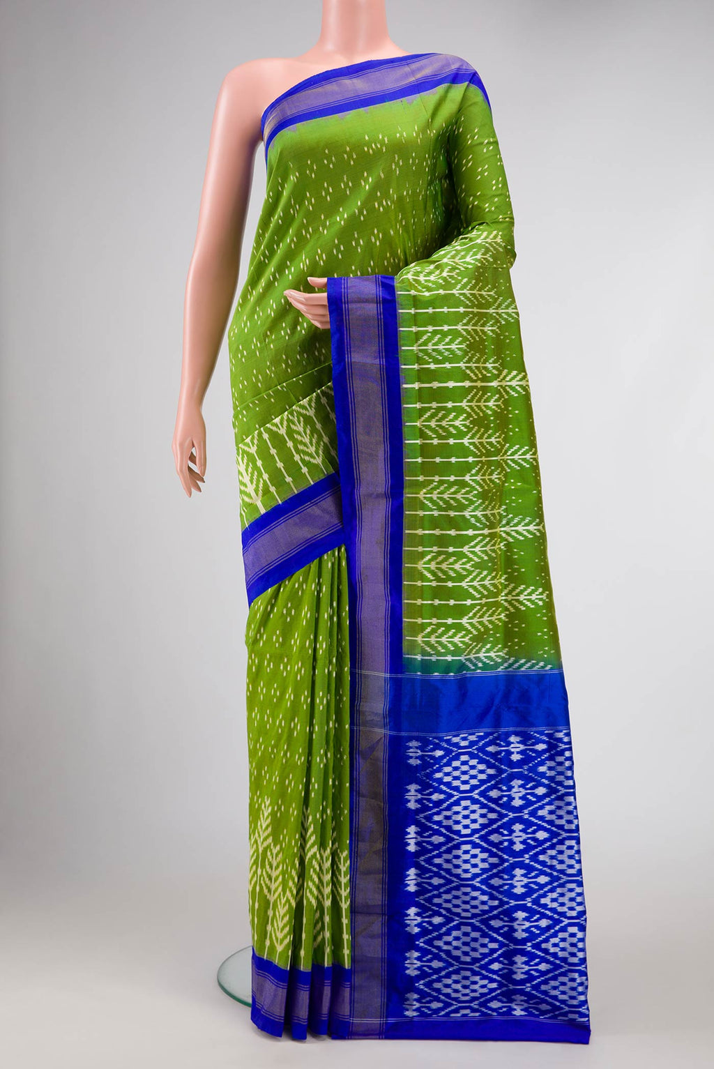 Green Pochampally Silk Saree with Pure Ikat on the body and Zari Border displayed on a mannequin