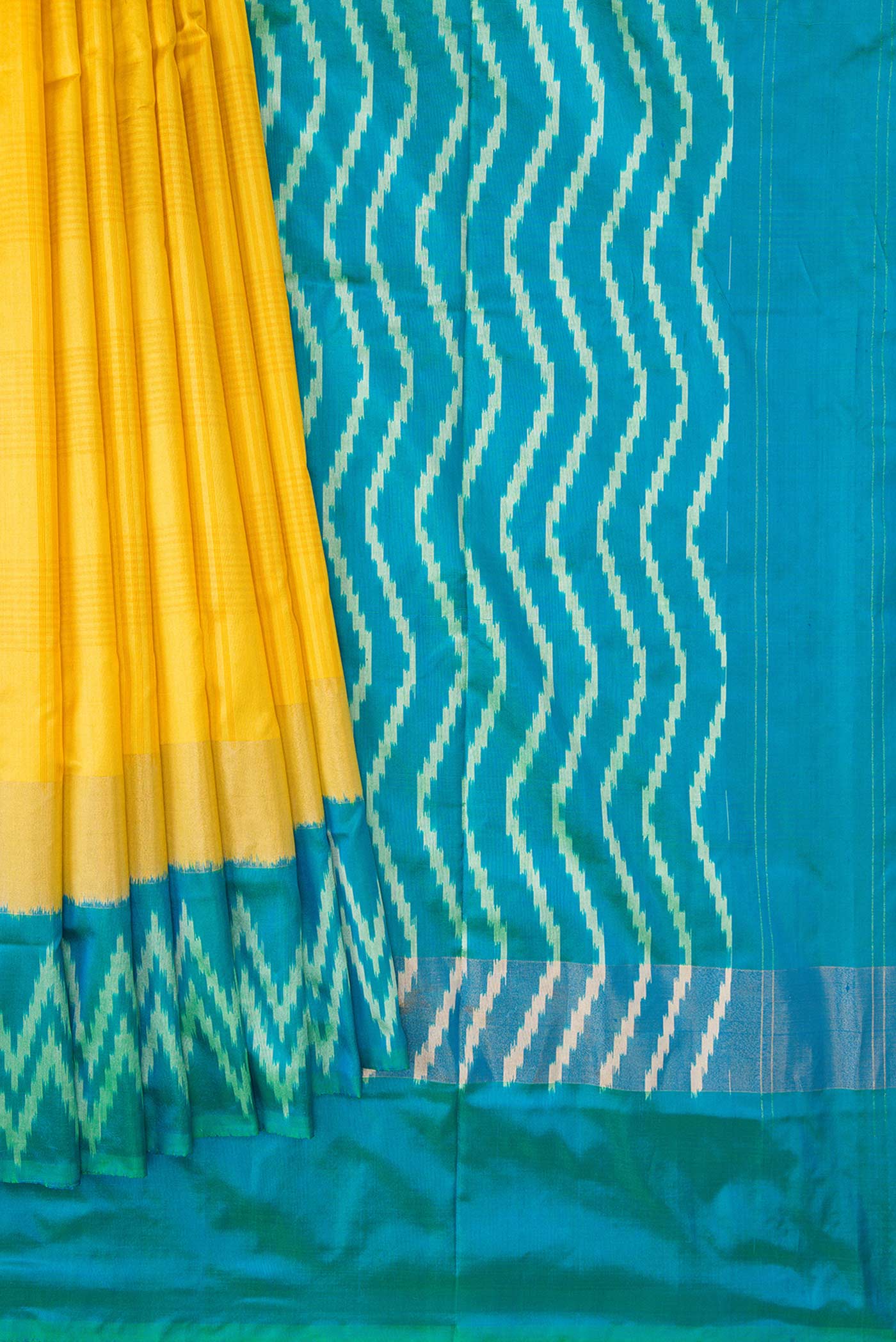 Pleats and pallu of Yellow Pochampally Silk Saree with Checked design on the body and Ikat Border