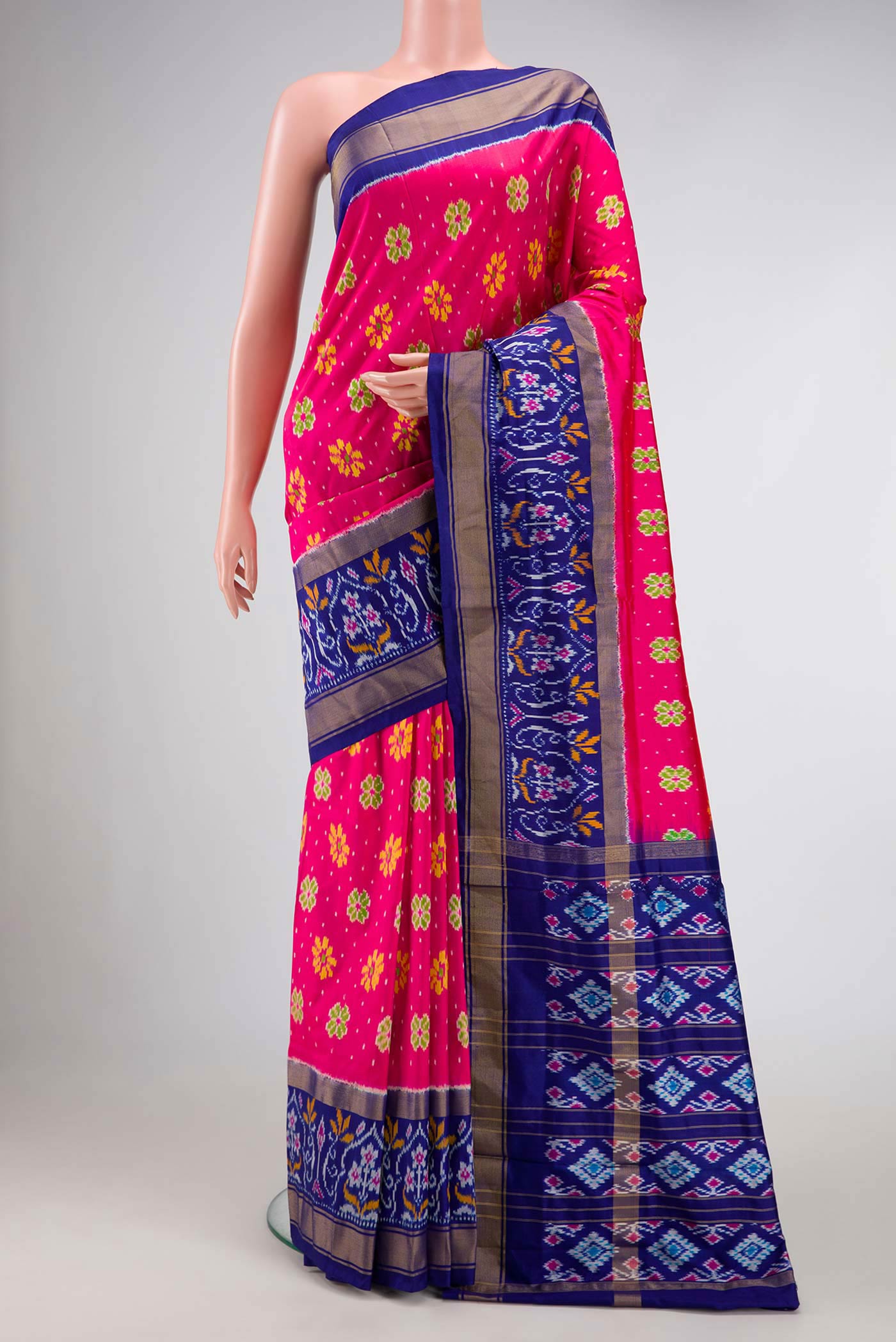 Pink Dual Tone Double Ikat Saree with Ikat Print on the body and Ikat Border.  displayed on a mannequin