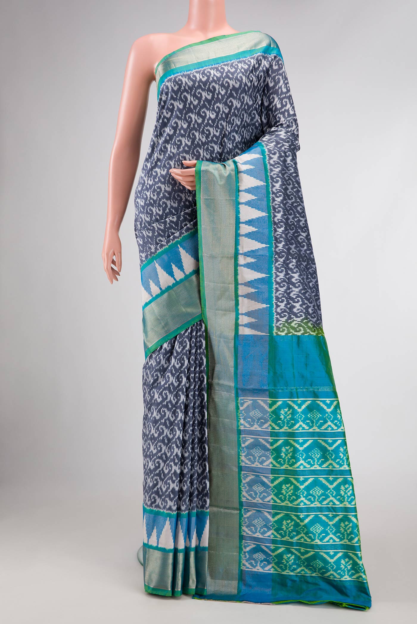 Grey Dual Tone Double Ikat Saree with Ikat Print on the body and Ikat Border displayed on a mannequin