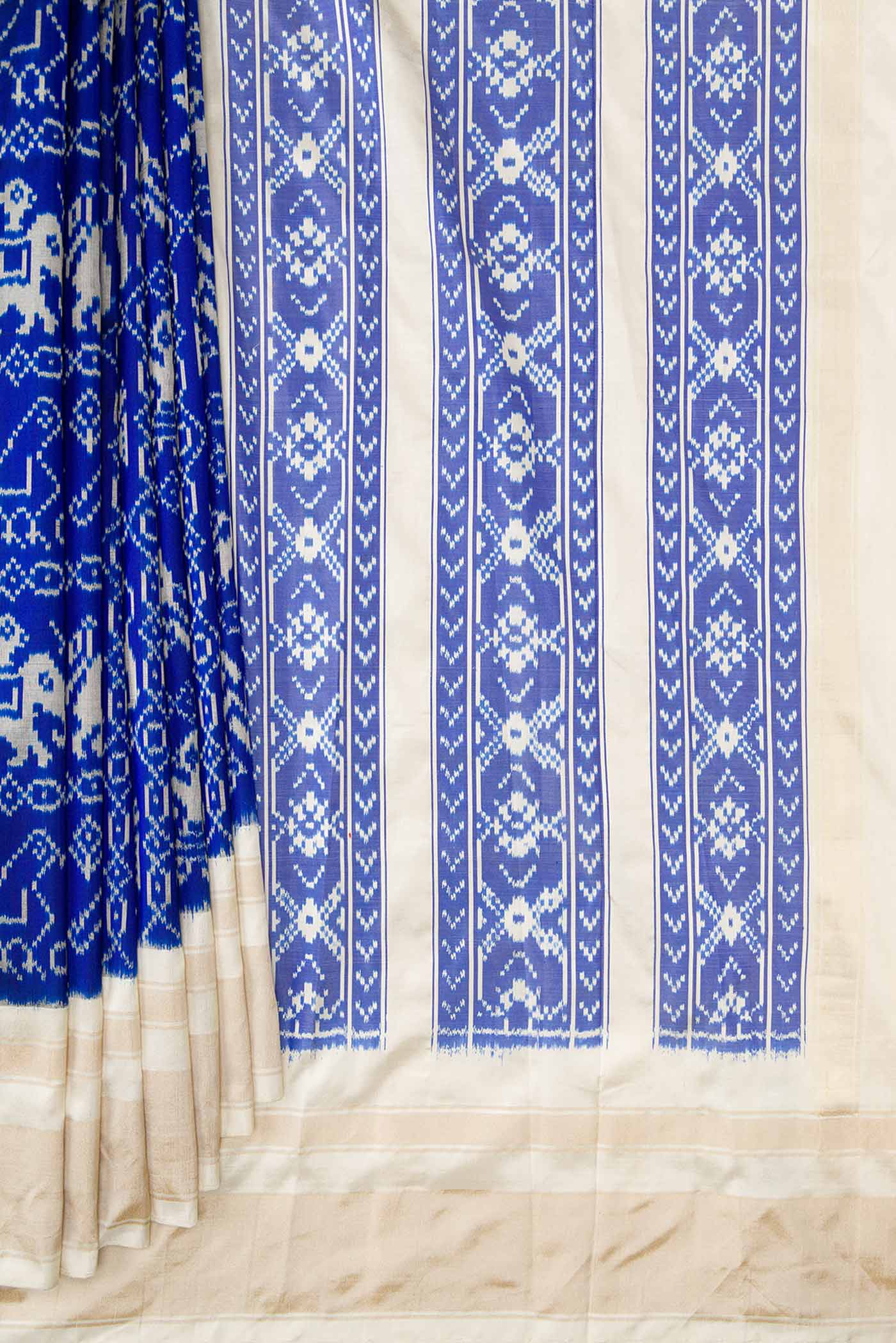 Pleats and pallu of Royal Blue Dual Tone Double Ikat Saree with Ikat Print on the body and Zari Border. 