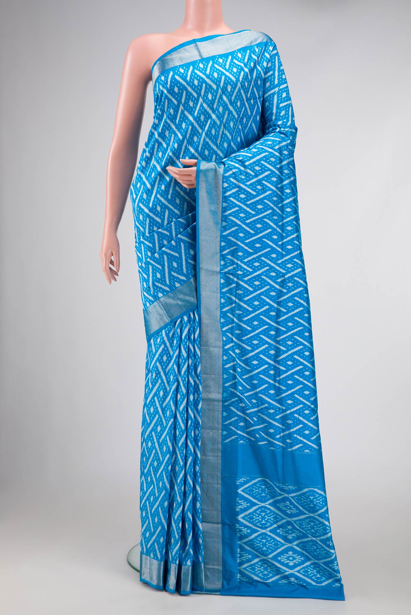 Sky Blue Pochampally Silk Saree with Pure Ikat on the body and Zari Border displayed on a mannequin