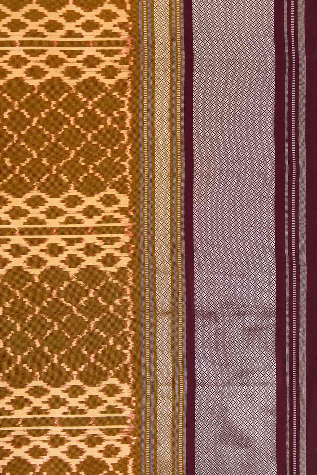 Border image of Mehandi Green Dual Tone Double Ikat Saree with Ikat Print on the body and Zari Border. 