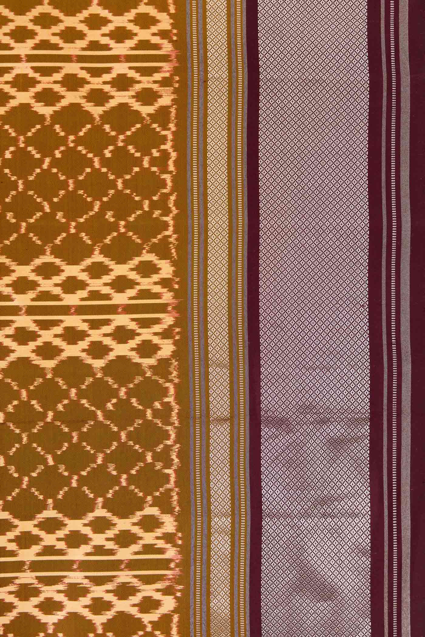 Border image of Mehandi Green Dual Tone Double Ikat Saree with Ikat Print on the body and Zari Border. 