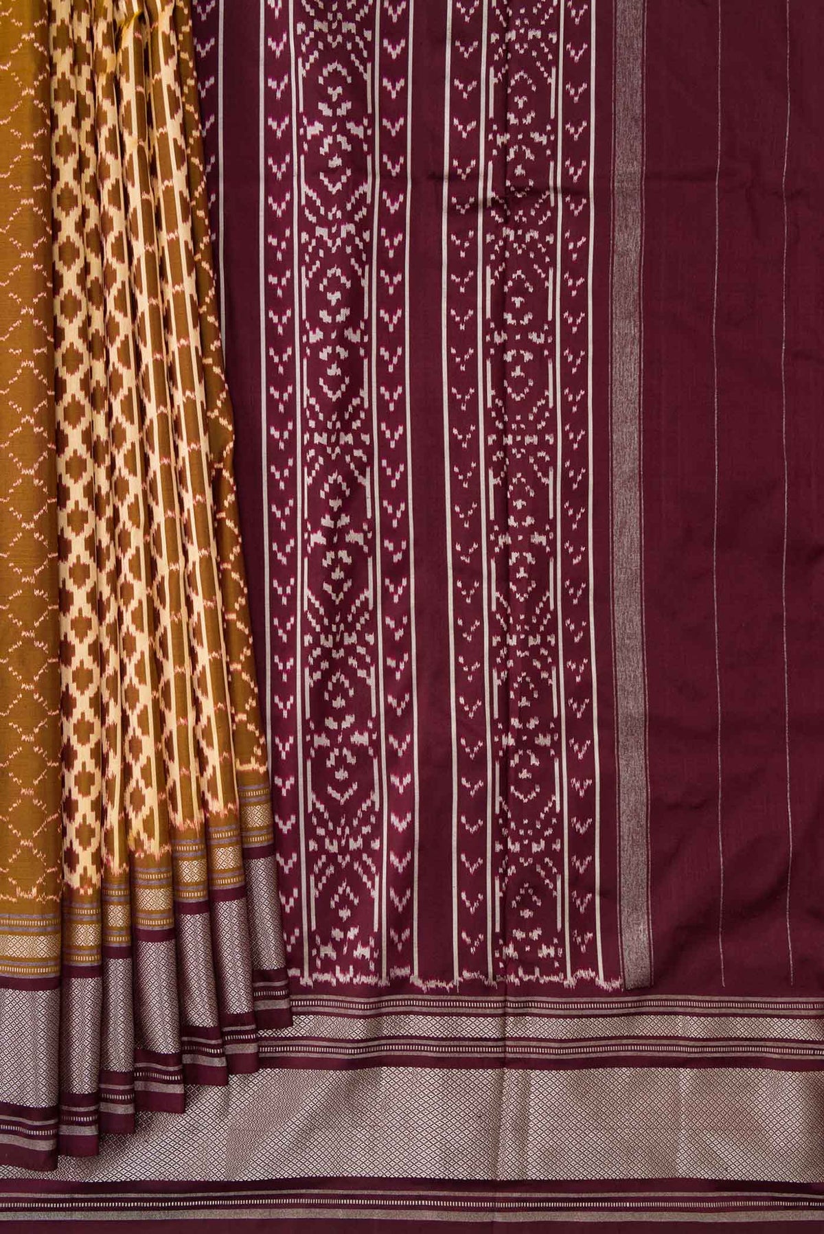 Pleats and pallu of Mehandi Green Dual Tone Double Ikat Saree with Ikat Print on the body and Zari Border. 