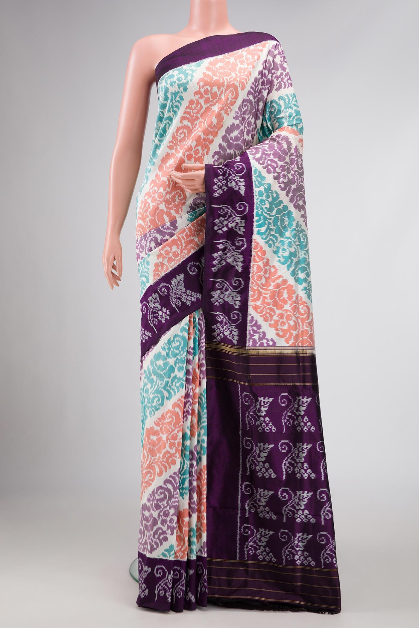 Off White Dual Tone Double Ikat Saree with Ikat Print on the body and Plain Border.  displayed on a mannequin