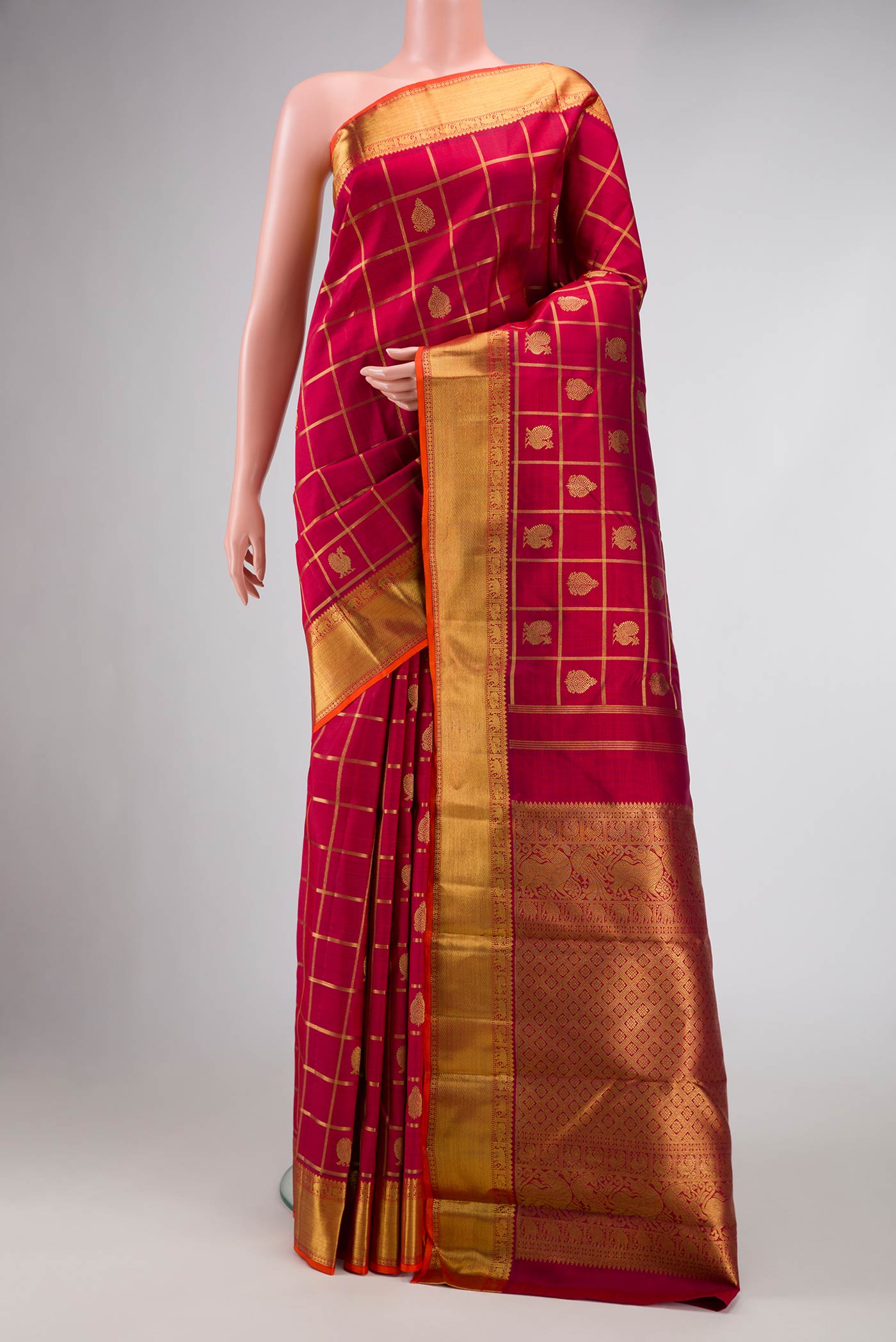 Pure Silk Pure Zari Maroon Dual Tone Kanjivaram Saree with Checked design on the body and Zari Border.  displayed on a mannequin