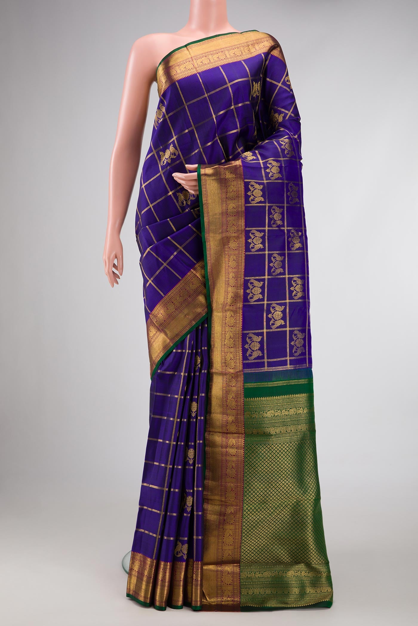 Royal Blue Dual Tone Kanjivaram Silk Saree with Checked design on the body and Zari Border.  displayed on a mannequin