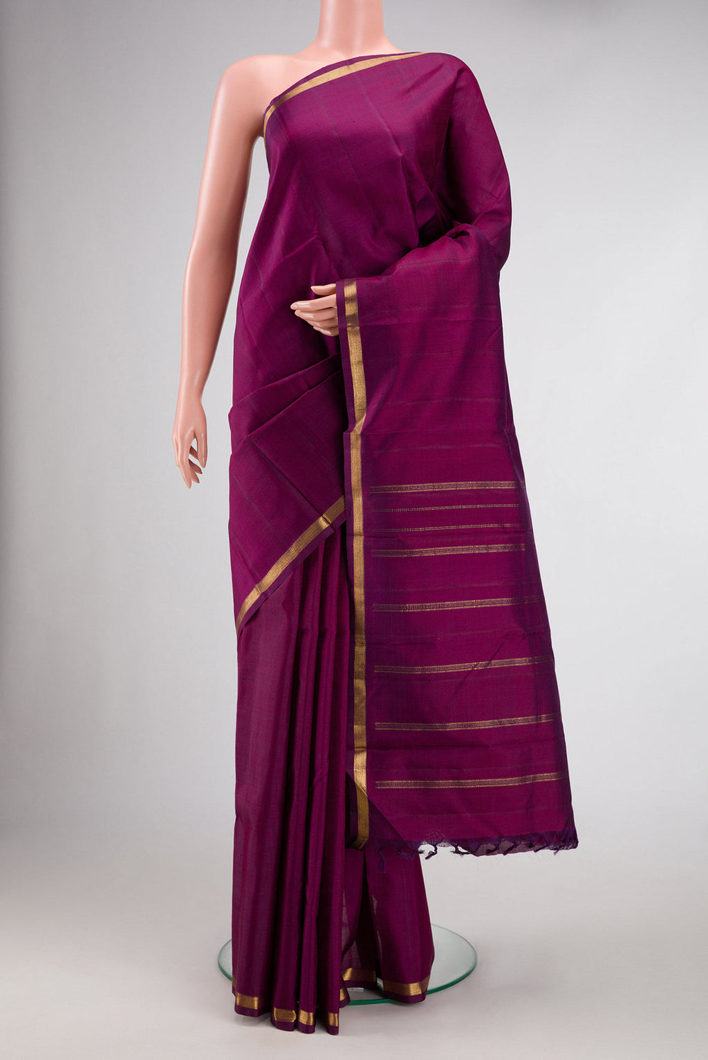 Maroon Dual Tone Kanchipuram Silk Saree with Plain Body and Zari Border.  displayed on a mannequin