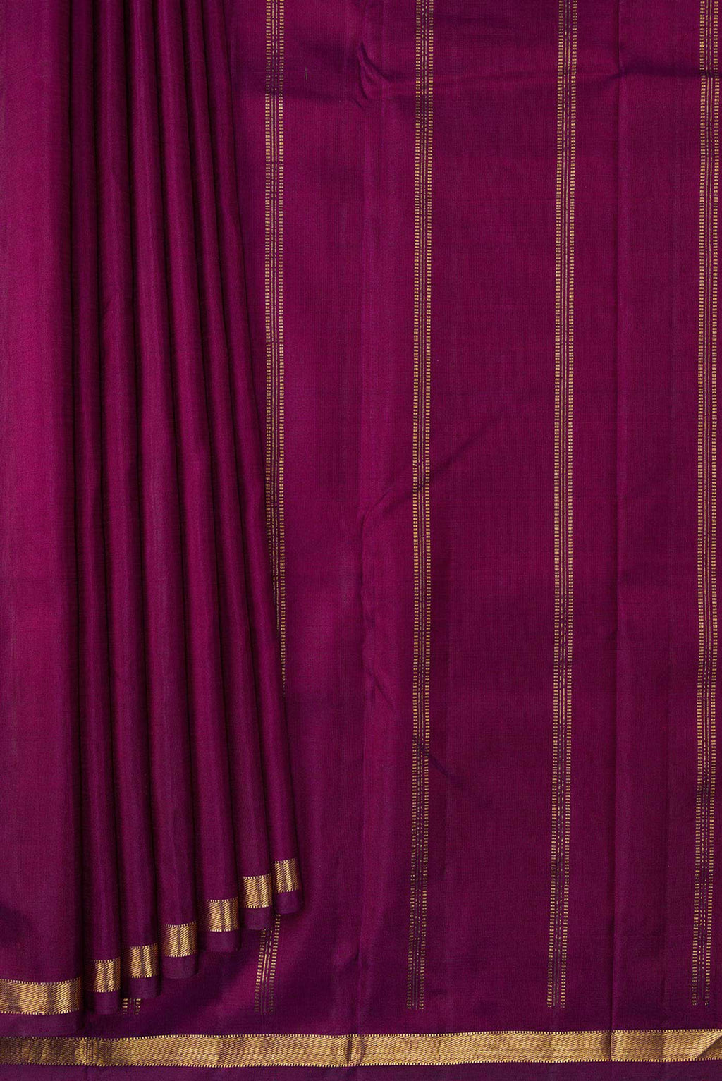 Pleats and pallu of Maroon Dual Tone Kanchipuram Silk Saree with Plain Body and Zari Border. 