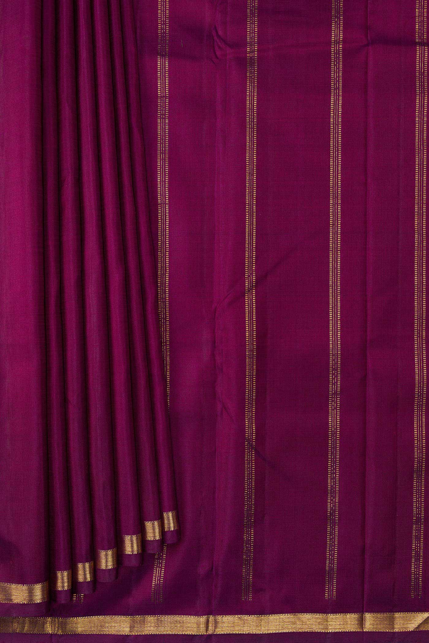 Pleats and pallu of Maroon Dual Tone Kanchipuram Silk Saree with Plain Body and Zari Border. 