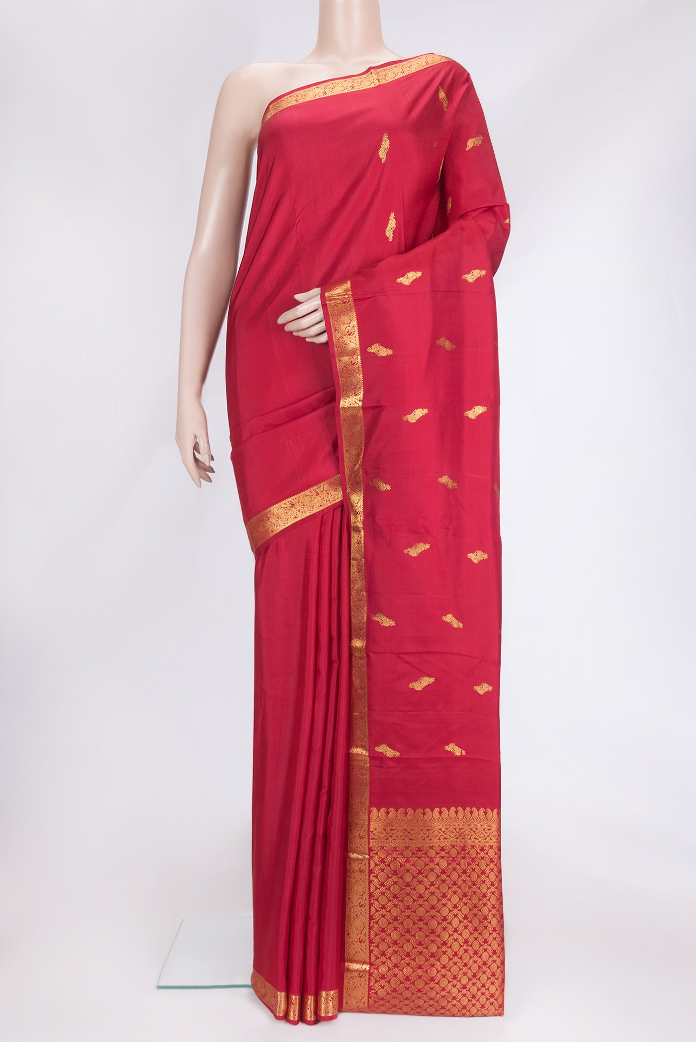 Maroon Dual Tone Kanchipuram Silk Saree with Zari Butta on the body and Zari Border.  displayed on a mannequin