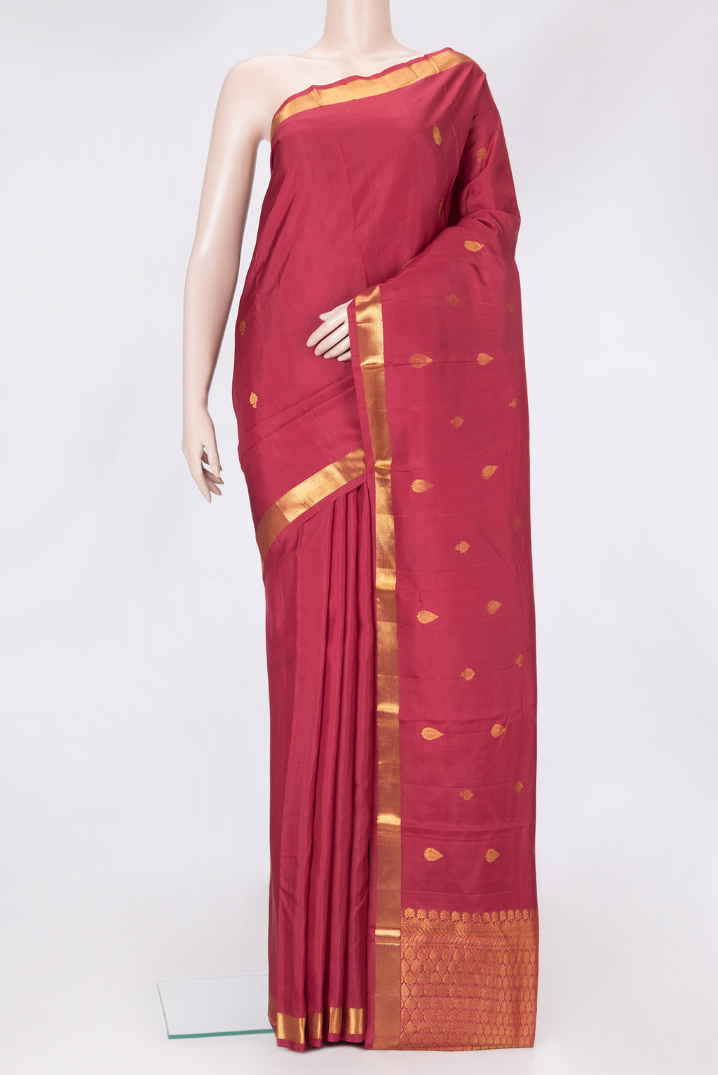 Maroon Dual Tone Kanchipuram Silk Saree with Zari Butta on the body and Zari Border.  displayed on a mannequin