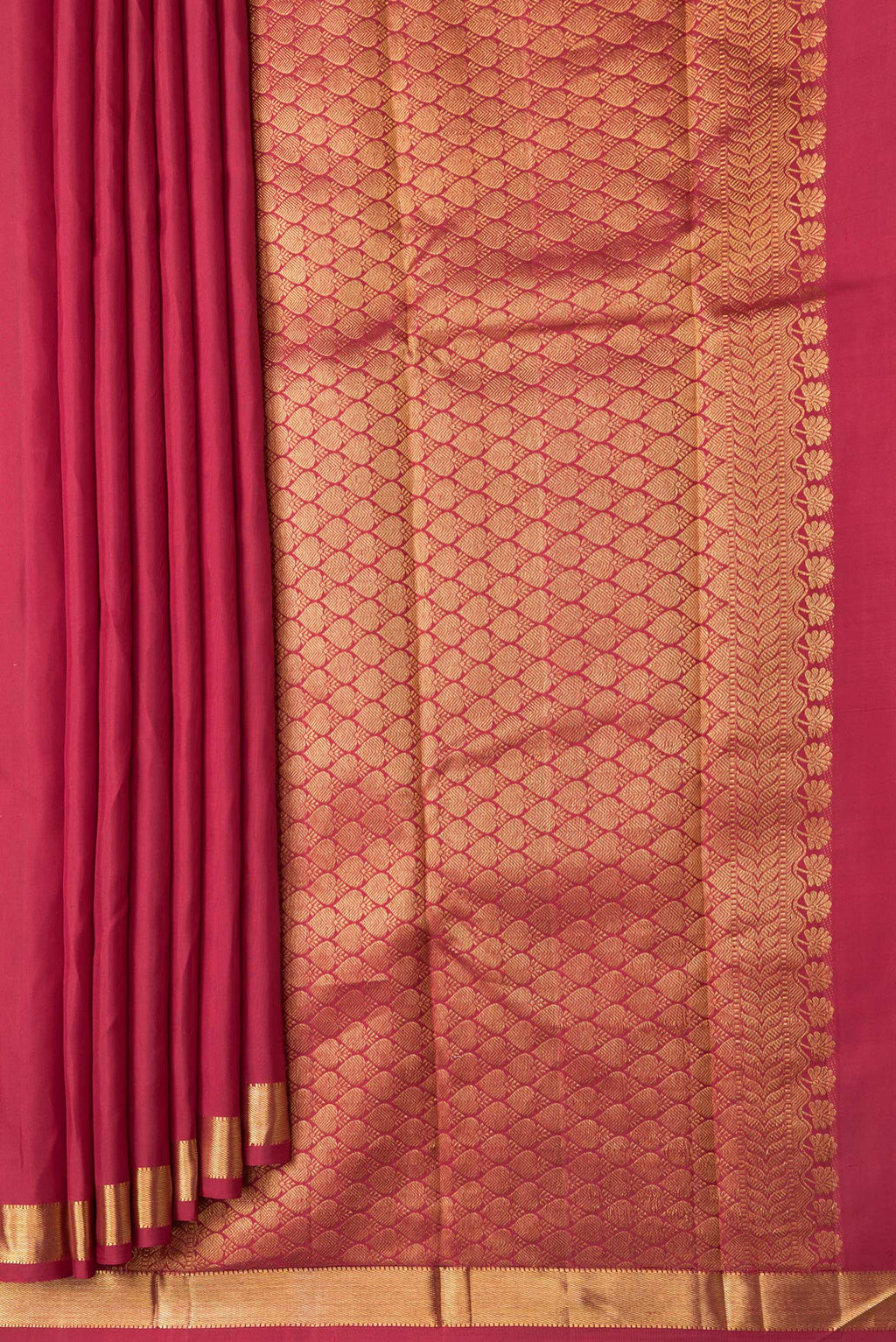 Pleats and pallu of Maroon Dual Tone Kanchipuram Silk Saree with Zari Butta on the body and Zari Border. 