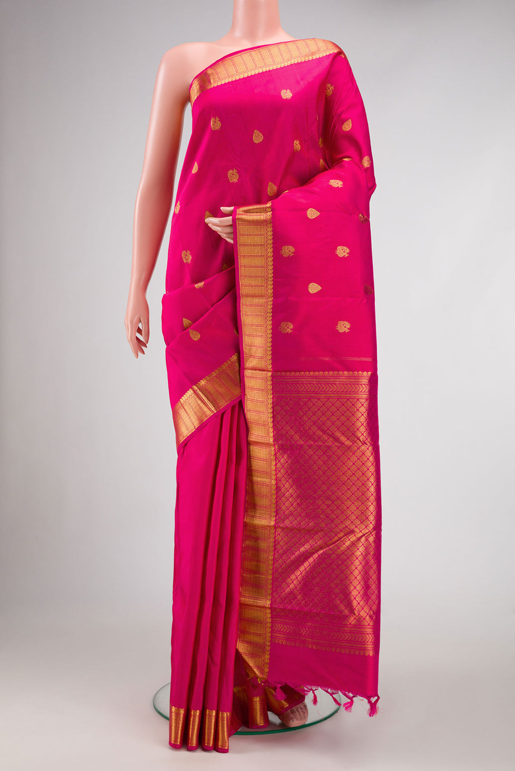 Pink Dual Tone Kanjivaram Silk Saree with Zari Butta on the body and Zari Border.  displayed on a mannequin